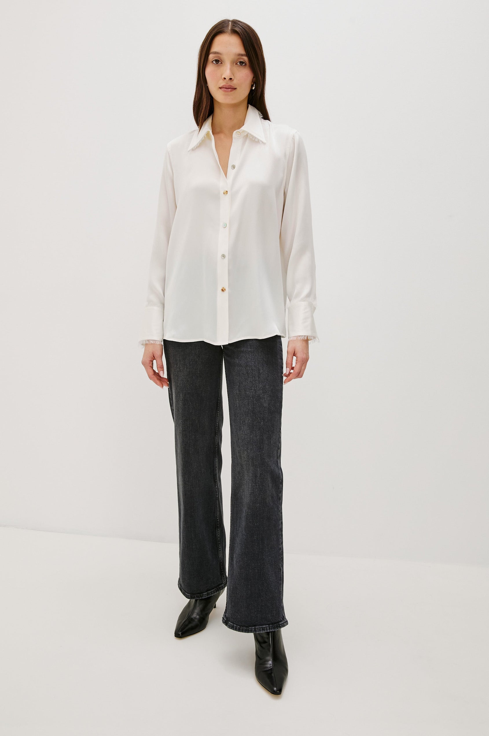 Abbey silk long sleeve button-down shirt with a raw edge trim at the collar and sleeve cuffs in Ivory colorway - full body front view on model
