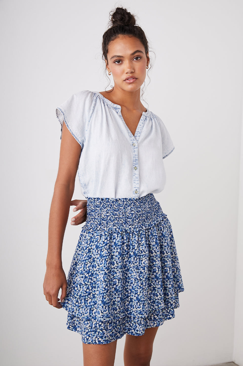 Addison Mini Skirt with a Smocked Waist and a Shorter Over Layer in Ice Chrysanthemum Colorway, Abstract Floral in White and Blues - Front View Featured on Model