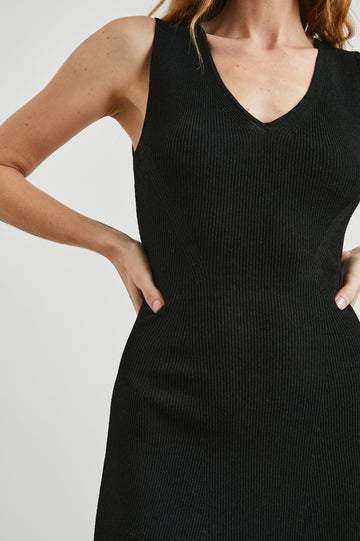 Adaline Ribbed, Sleeveless, Above-the-Knee Dress with Shoulder Straps and a V Neck in Black Colorway - Front View Featured on Model  