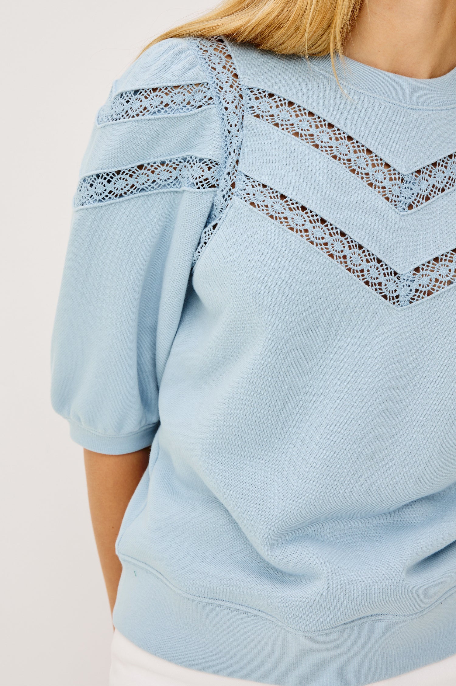 Adria Crewneck Top in French Terry With Sheer Crochet Insets at Front, Back, and Short Puff Sleeves in Sky Colorway - Upper Body Front View Featured on Model