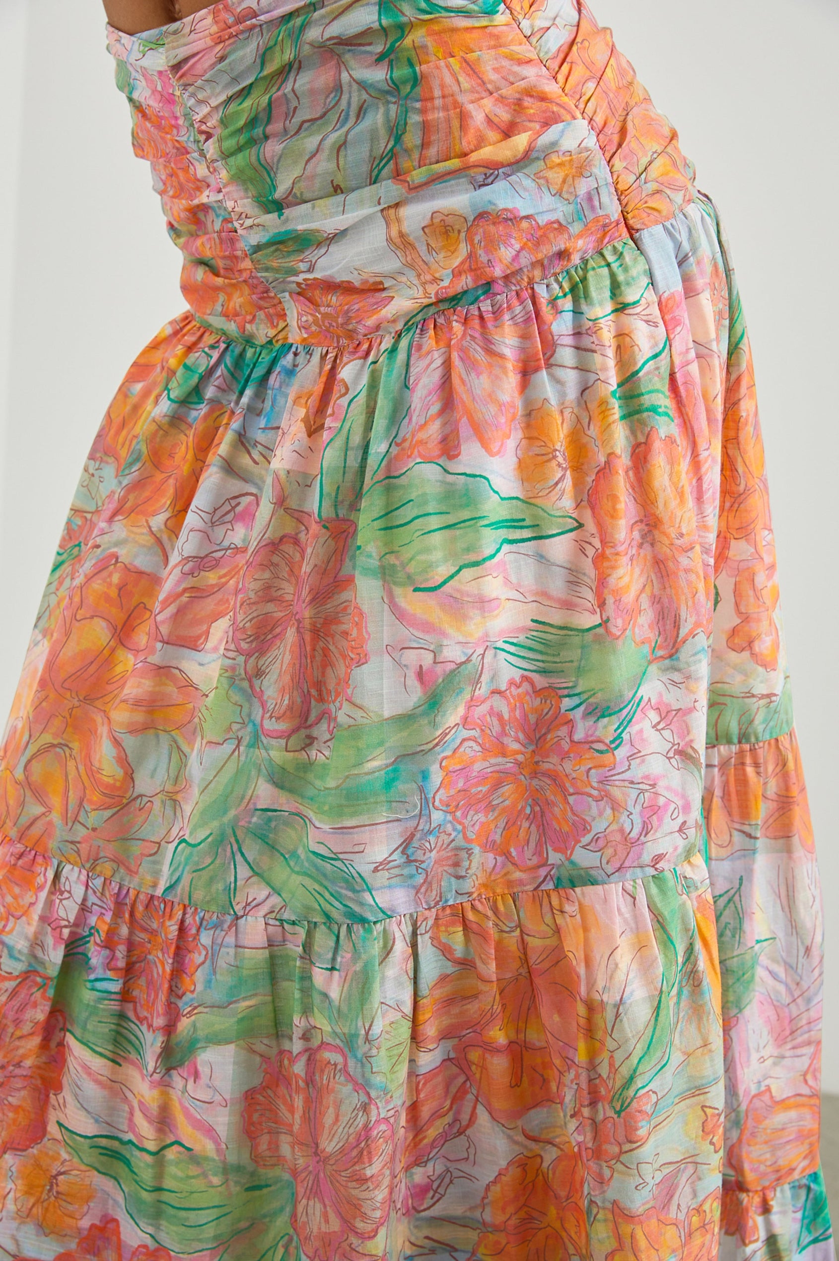 Agatha Maxi Tiered Skirt with Ruching at the Waist in Tropics Colorway, Flowers in Oranges, Pinks and Greens on White - Front View Featured on Model  