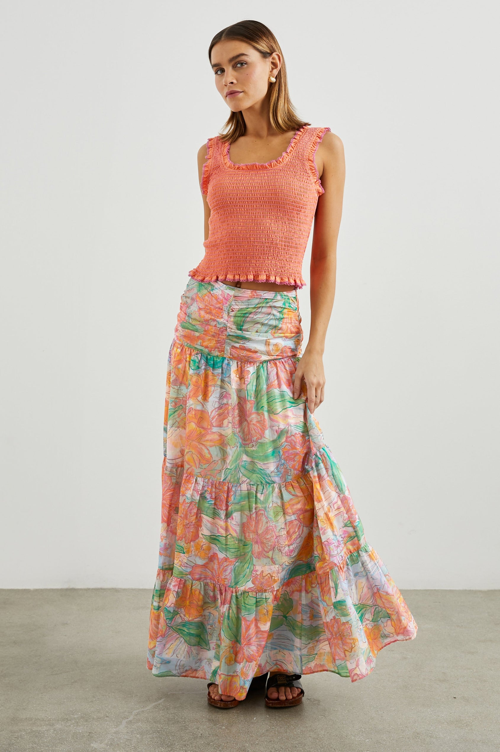 Agatha Maxi Tiered Skirt with Ruching at the Waist in Tropics Colorway, Flowers in Oranges, Pinks and Greens on White - Front View Featured on Model  