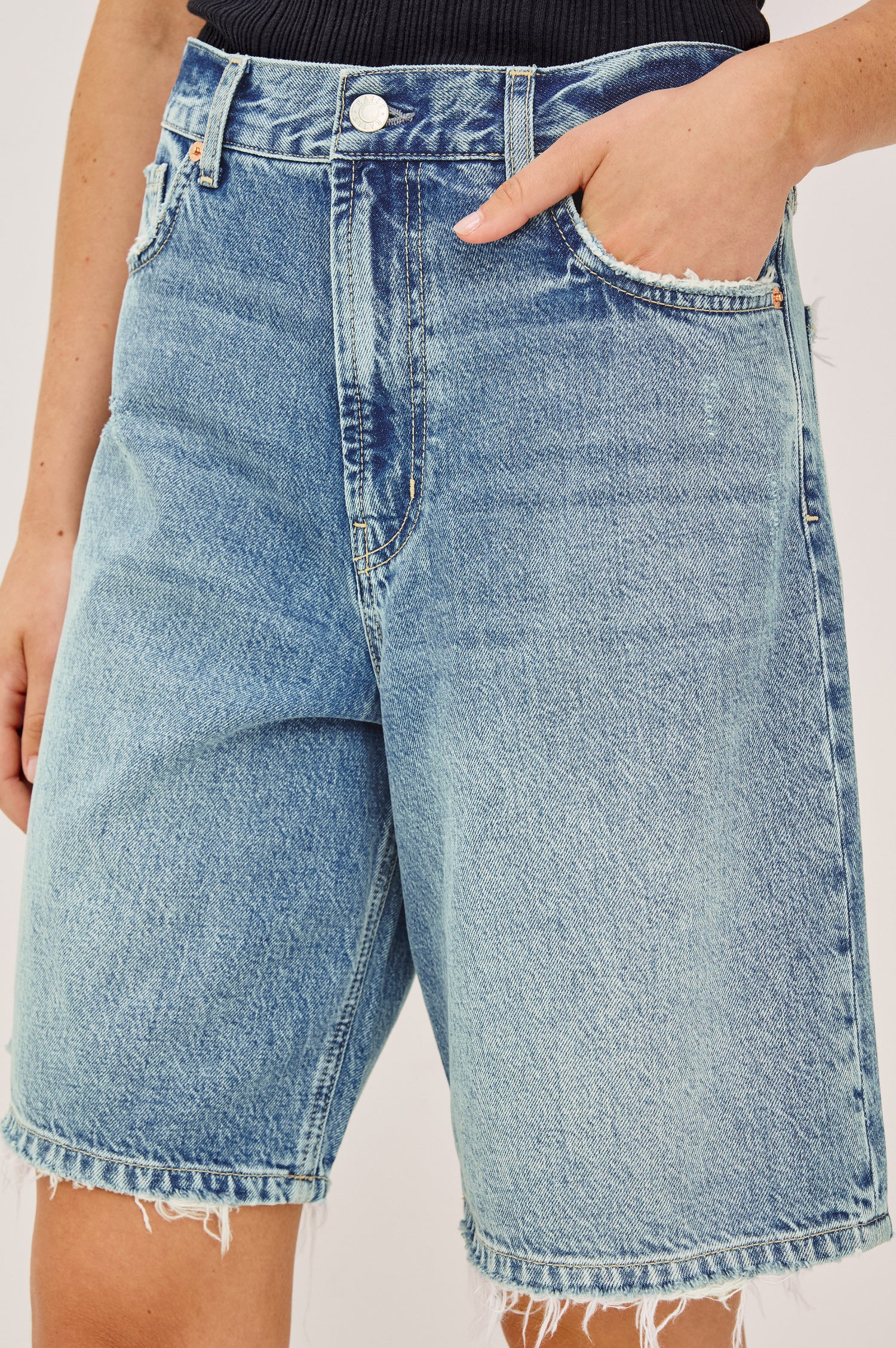 Agoura Short in Rigid Denim With Wide Leg, Relaxed, Low-Slung Fit, Distressed Detailing, Zip Fly, Belt Loops, and 5-Pockets in Authentic Stone Colorway - Lower Body Front View Featured on Model