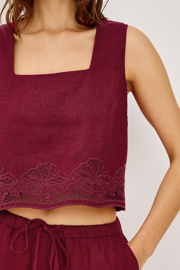 Akira Tank Top in Linen With Square Neckline Wide Fixed Shoulder Straps and Cropped Loose Fit in Berry Hibiscus Embroidery Colorway - Upper Body Close Up Front VIew Featured on Model