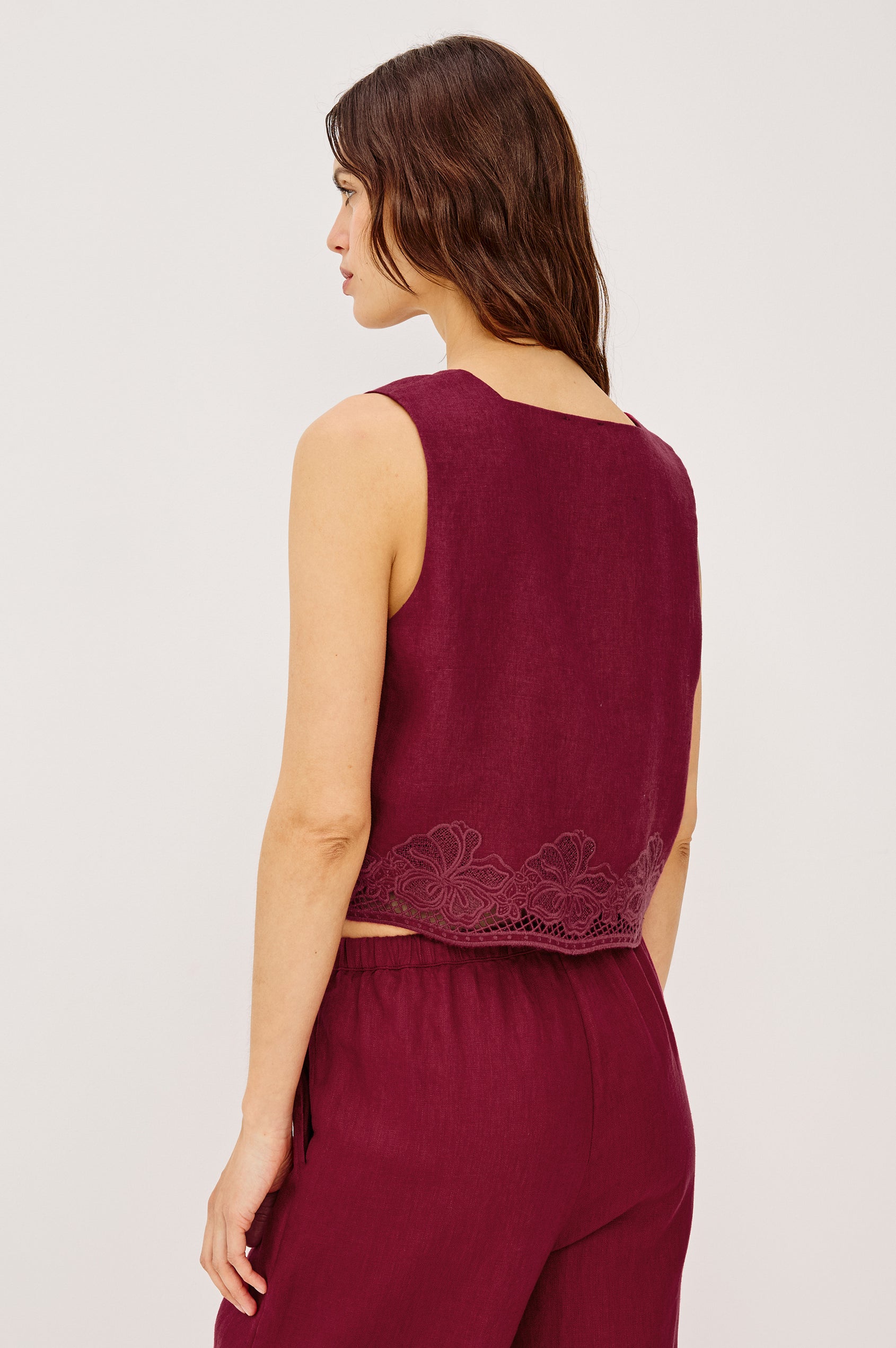 Akira Tank Top in Linen With Square Neckline Wide Fixed Shoulder Straps and Cropped Loose Fit in Berry Hibiscus Embroidery Colorway - Upper Body Back VIew Featured on Model