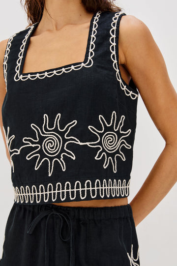 Akira Square Neck Crop Top with Wide Straps in White Contrast Sun Embroidery Colorway. Front Detailed View Shown on Model.