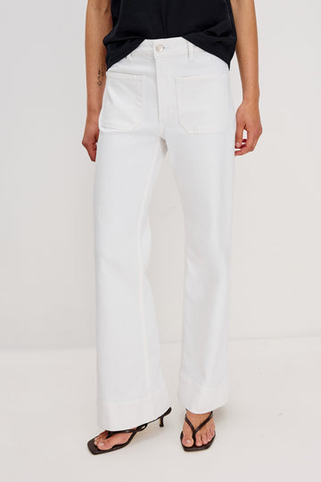 Alamitos Flared Denim Pant with Front Patch Pockets, Belt Loops and Zipper Button Fly in Salt White Colorway. Front View Shown on Model.