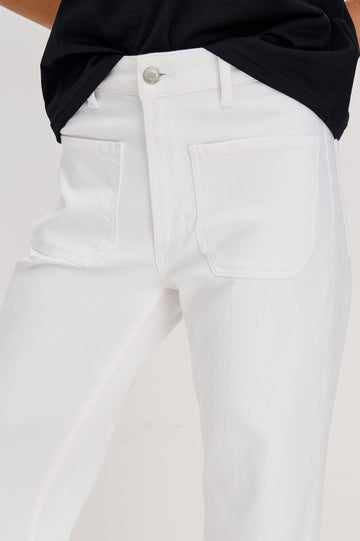 Alamitos Flared Denim Pant with Front Patch Pockets, Belt Loops and Zipper Button Fly in Salt White Colorway. Front Detail View Shown on Model.