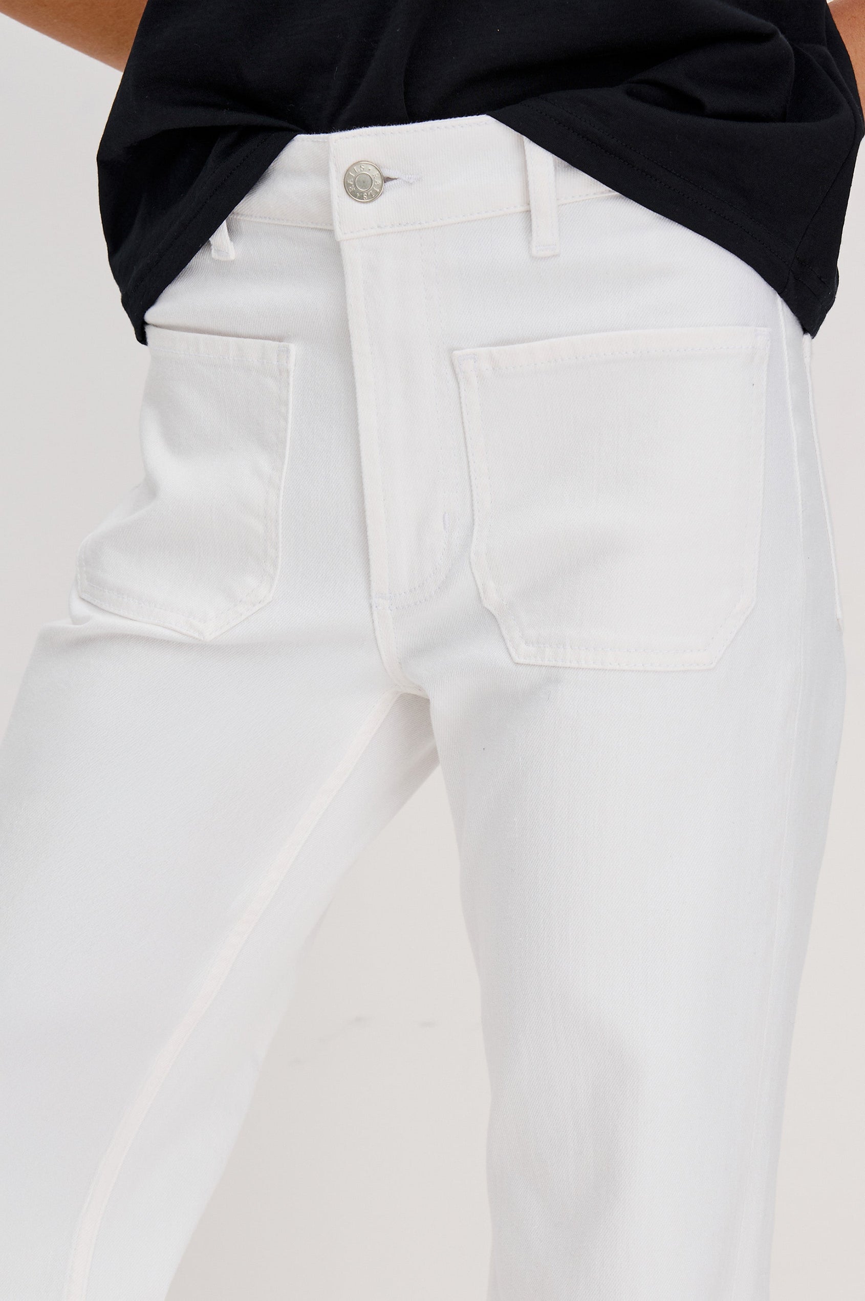 Alamitos Flared Denim Pant with Front Patch Pockets, Belt Loops and Zipper Button Fly in Salt White Colorway. Front Detail View Shown on Model.