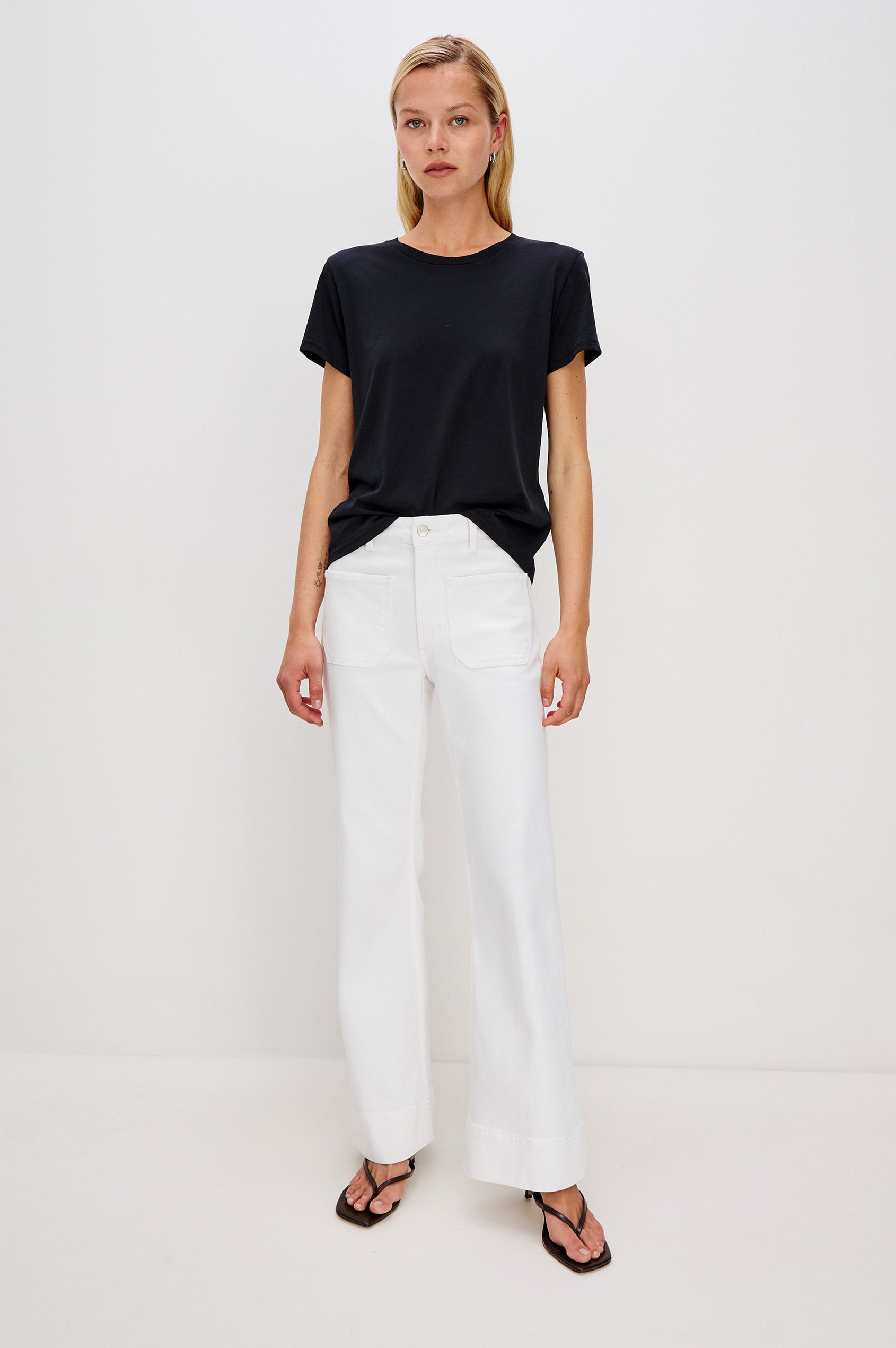 Alamitos Flared Denim Pant with Front Patch Pockets, Belt Loops and Zipper Button Fly in Salt White Colorway. Front Full Body View Shown on Model.