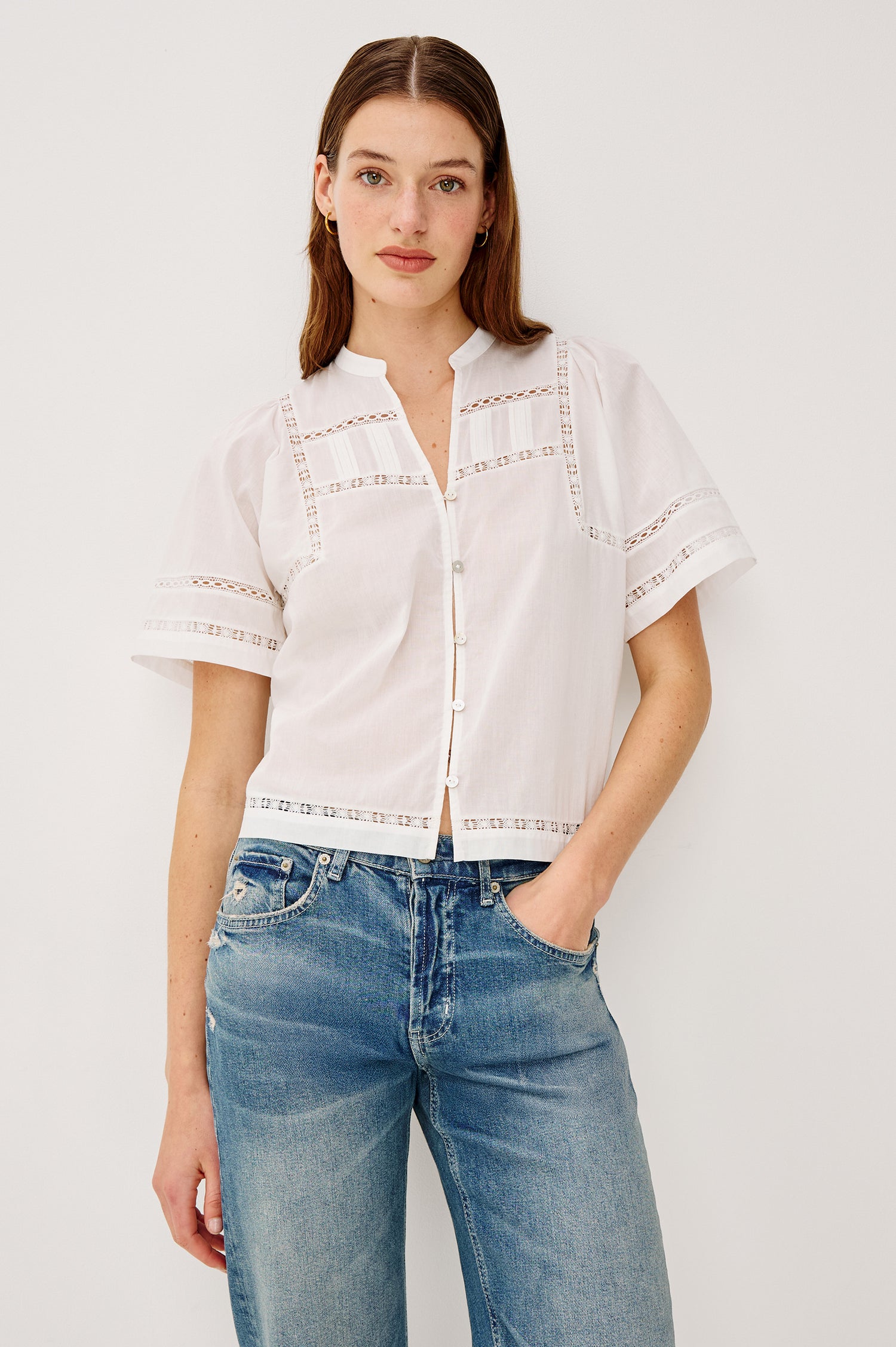 Alanis Shirt in Lightweight Cotton With Split Band V-Neckline, Front Button-and-Loop Closures, Lattice Embroidery, and Short Puff Sleeves in White Colorway - Upper Body Front View Featured on Model