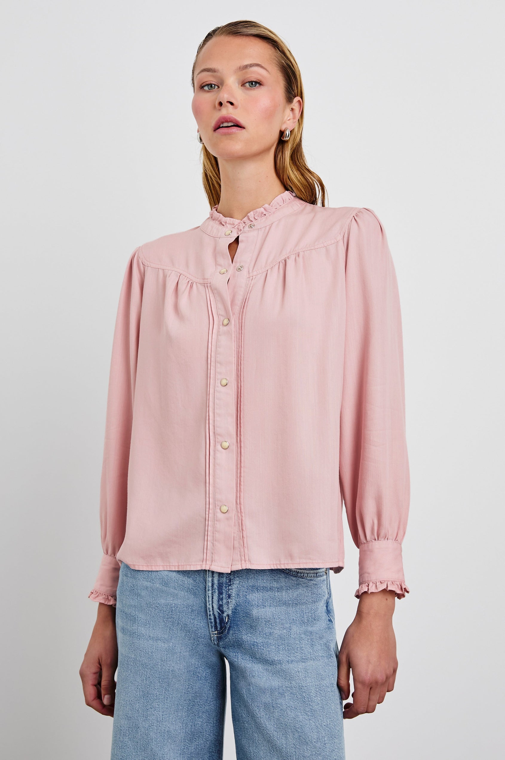 Alanna Long Sleeve Shirt with Snaps Down the Front, a Ruffled Collar, Banded Ruffed Cuffs, and Pleats at the Yoke Seam in Dusty Rose Colorway - Front View Featured on Model
