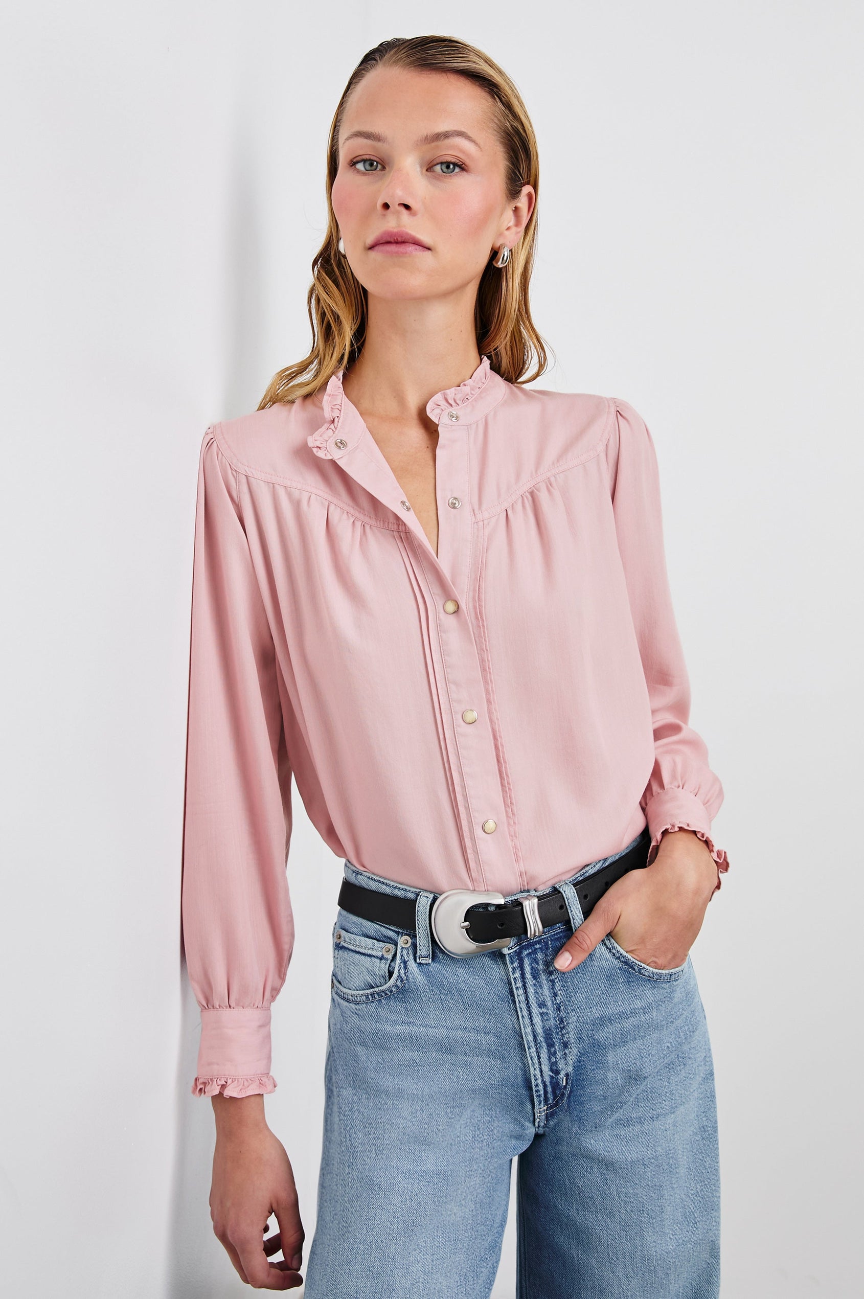Alanna Long Sleeve Shirt with Snaps Down the Front, a Ruffled Collar, Banded Ruffed Cuffs, and Pleats at the Yoke Seam in Dusty Rose Colorway - Front Tucked View Featured on Model