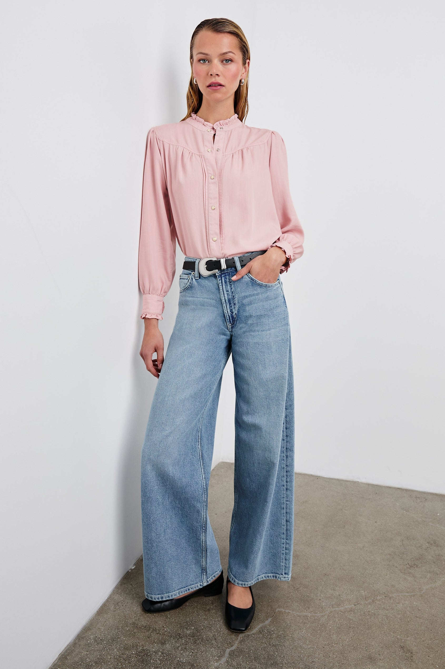 Alanna Long Sleeve Shirt with Snaps Down the Front, a Ruffled Collar, Banded Ruffed Cuffs, and Pleats at the Yoke Seam in Dusty Rose Colorway - Front Tucked Full Body View Featured on Model