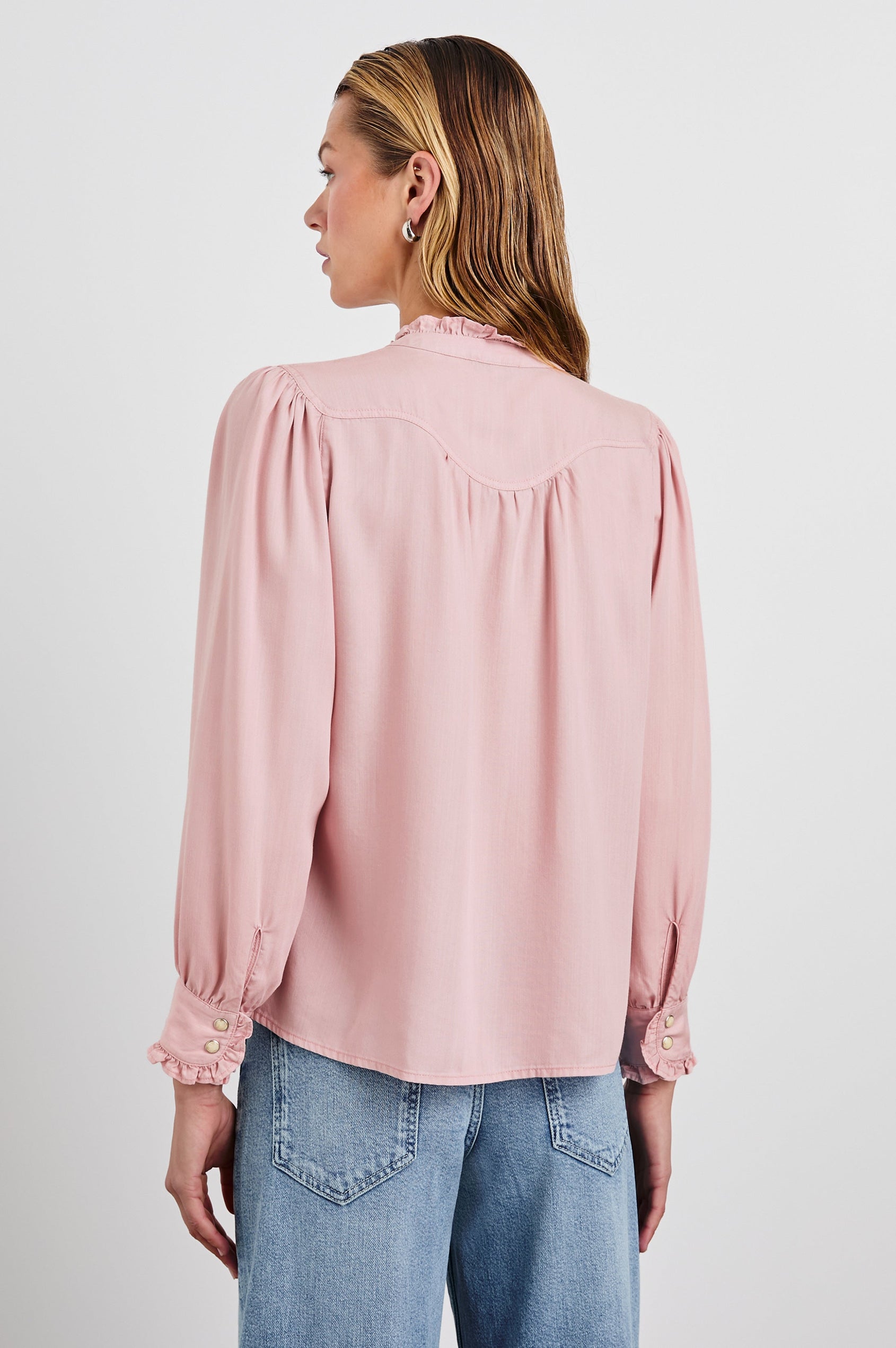 Alanna Long Sleeve Shirt with Snaps Down the Front, a Ruffled Collar, Banded Ruffed Cuffs, and Pleats at the Yoke Seam in Dusty Rose Colorway - Back View Featured on Model
