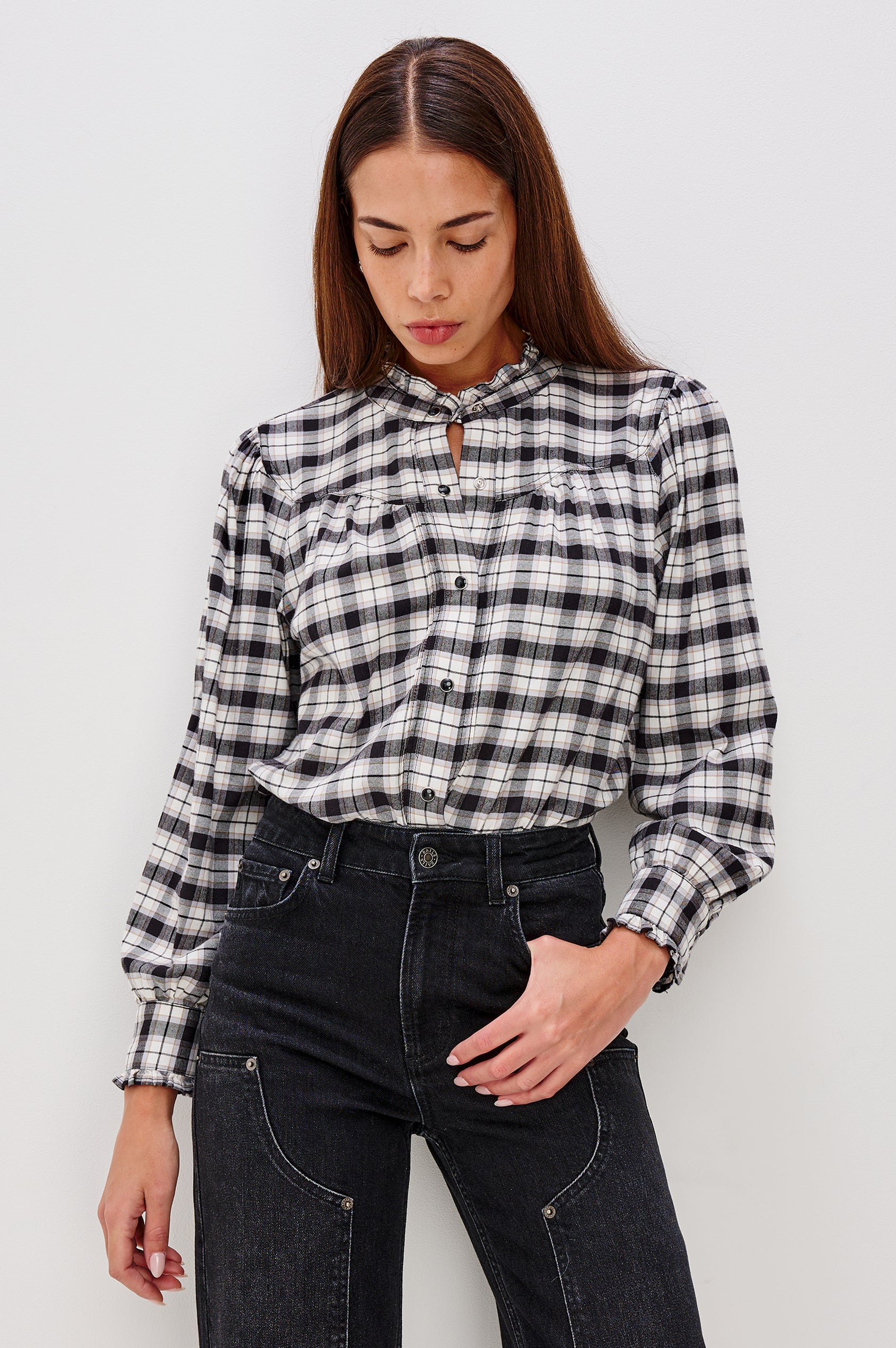 Alanna Long Sleeve Shirt with Snaps Down the Front, a Ruffled Collar, Banded Ruffed Cuffs, and Pleats at the Yoke Seam in Ivory Smoke Onyx Colorway - Front Tucked View Featured on Model