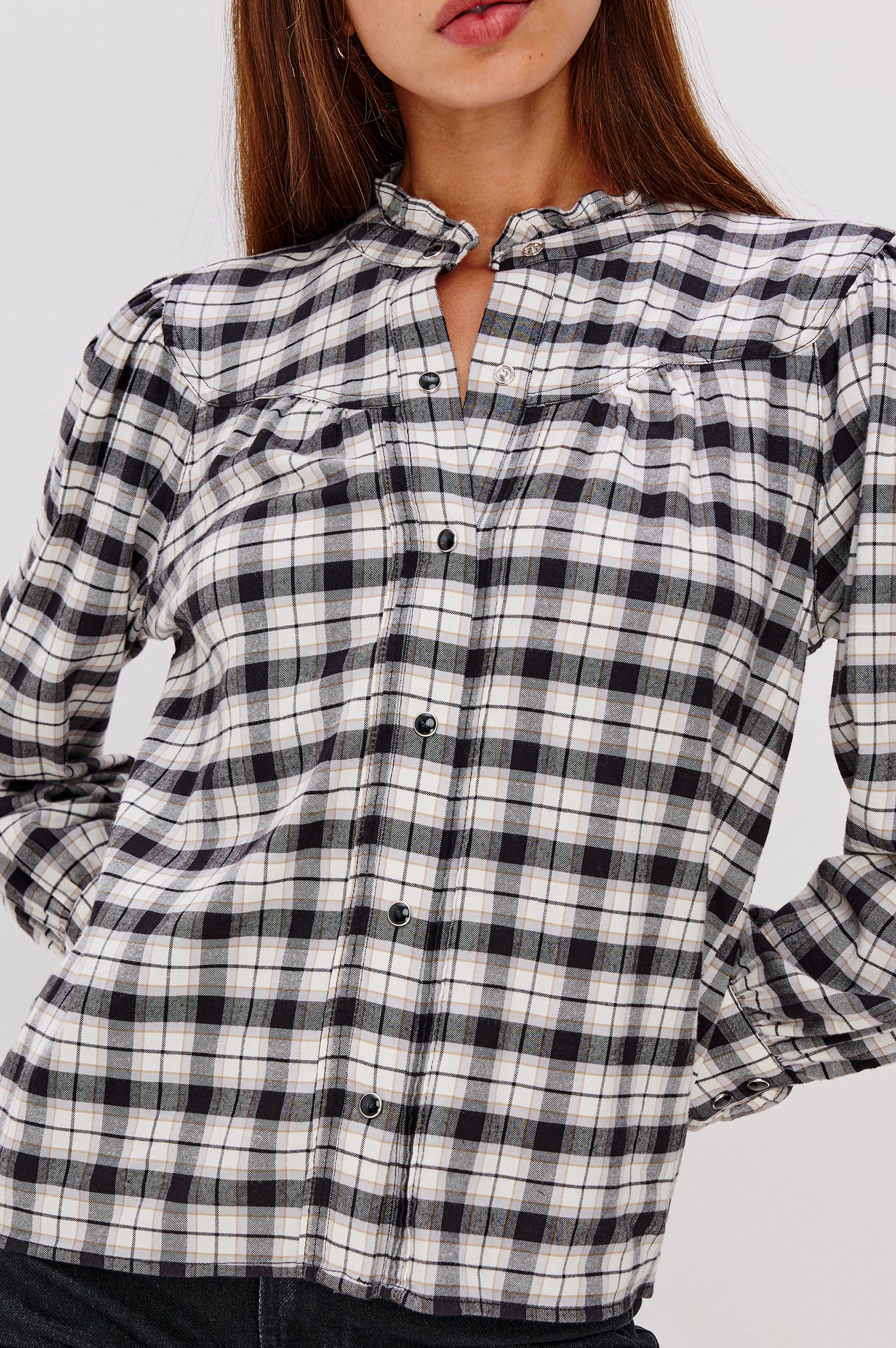 Alanna Long Sleeve Shirt with Snaps Down the Front, a Ruffled Collar, Banded Ruffed Cuffs, and Pleats at the Yoke Seam in Ivory Smoke Onyx Colorway - Close Up Untucked View Featured on Model
