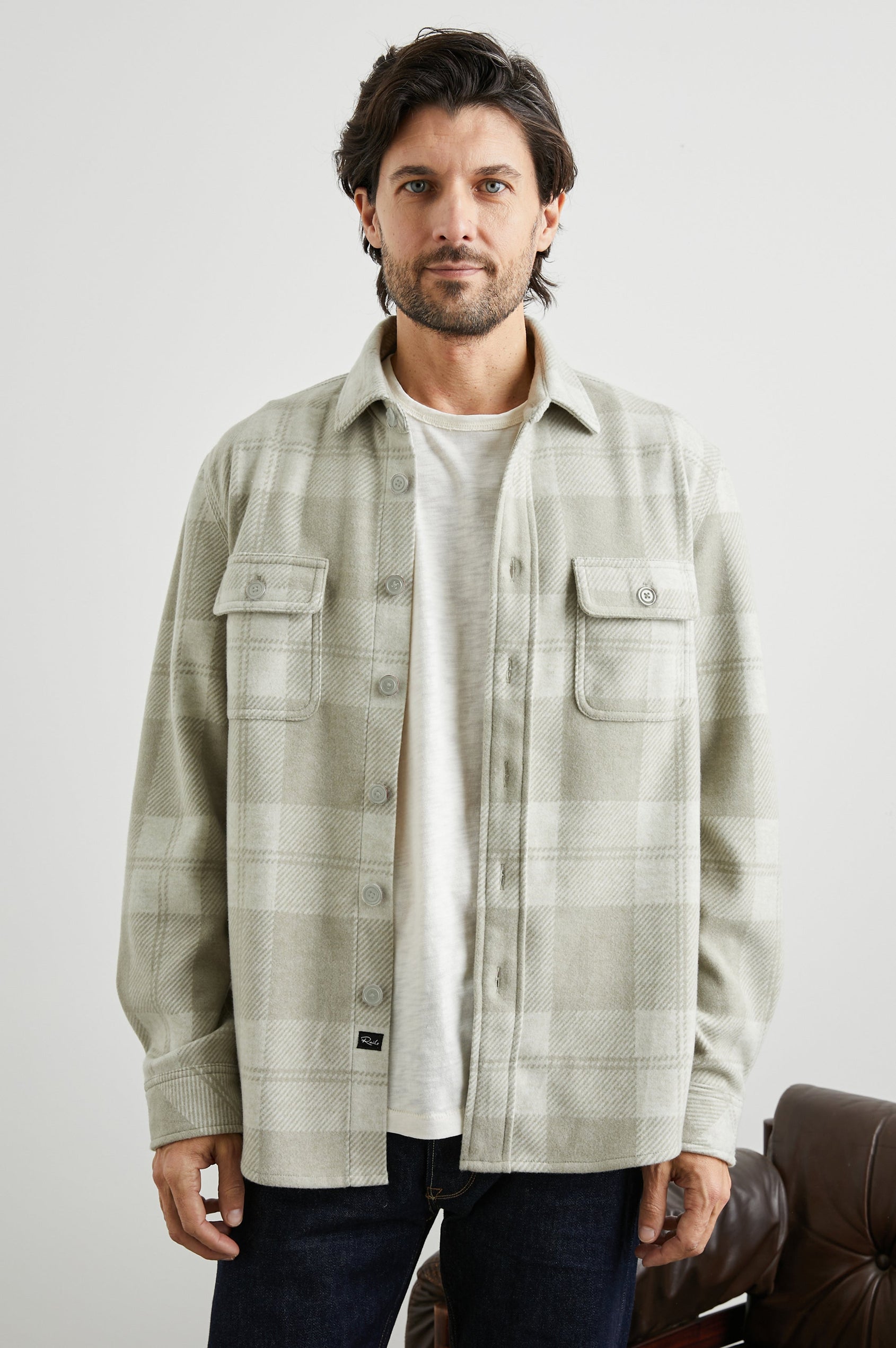 Alder Long-Sleeve Button up with Two Buttoned Chest Flap Pockets in Fawn Cream Colorway, a plaid - Front Unbuttoned View Featured on Model
