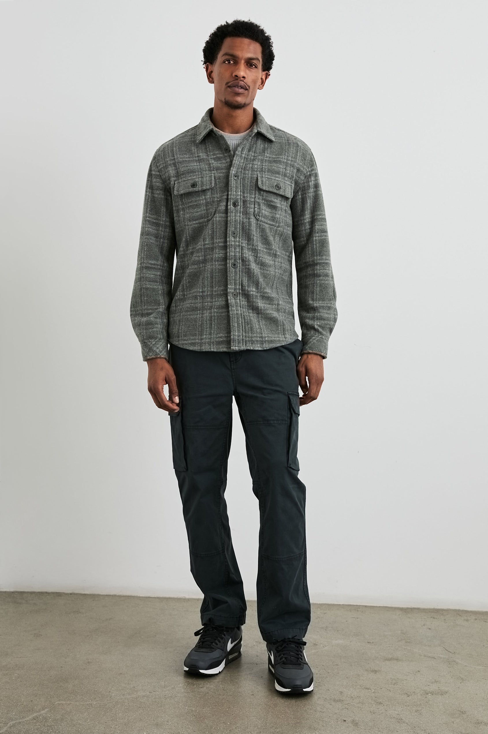 Alder Long-Sleeve Button up with Two Buttoned Chest Flap Pockets in Mossy Glen Colorway, a plaid - Front Full Body View Featured on Model