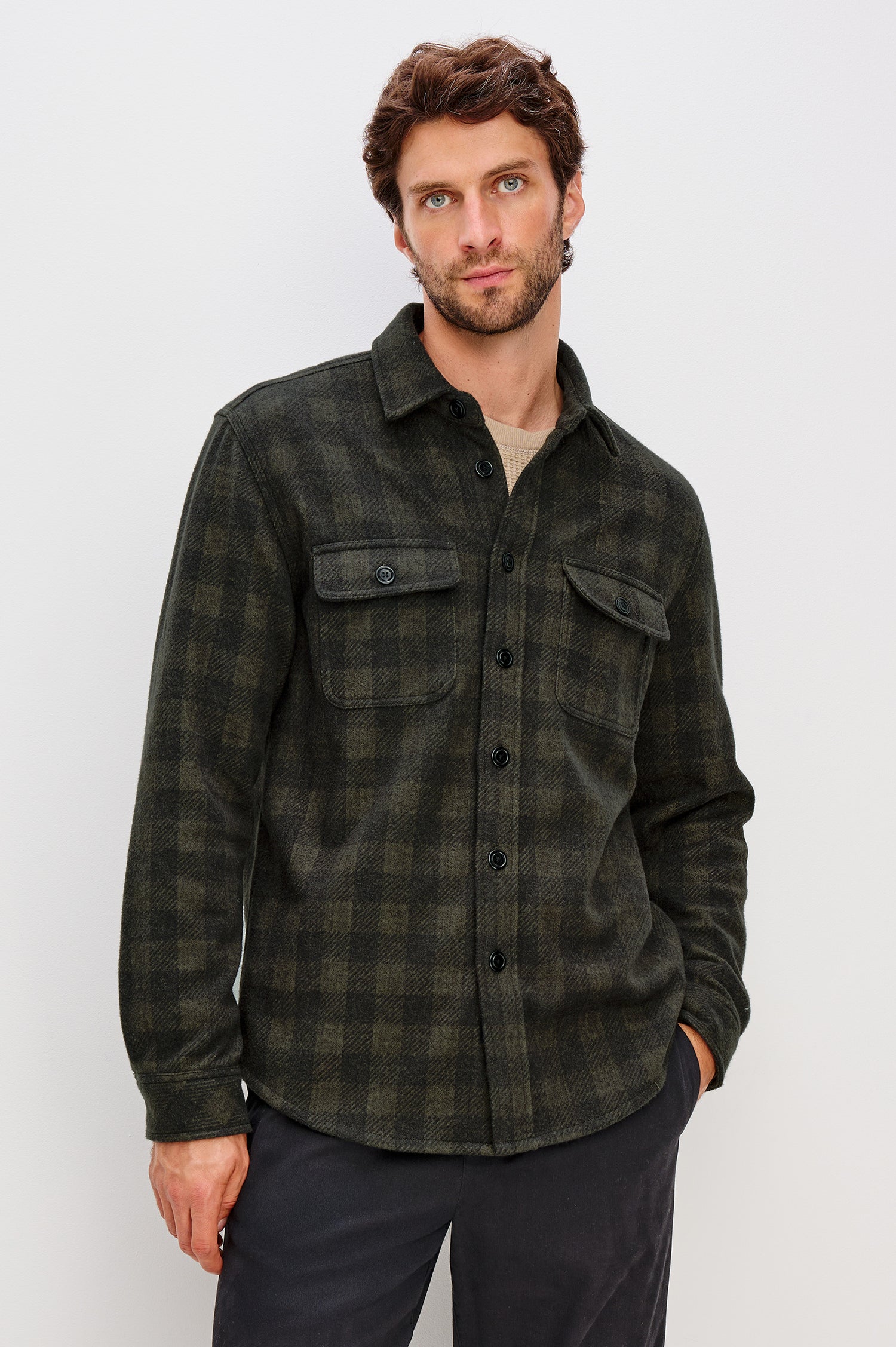 Alder Button Front Plaid Shirt in Brushed Stretch Cotton Blend With Collar, Buttoned Flap Chest Pockets, and Long Sleeves in Onyx Surplus Green Black Colorway - Upper Body Front View Featured on Model