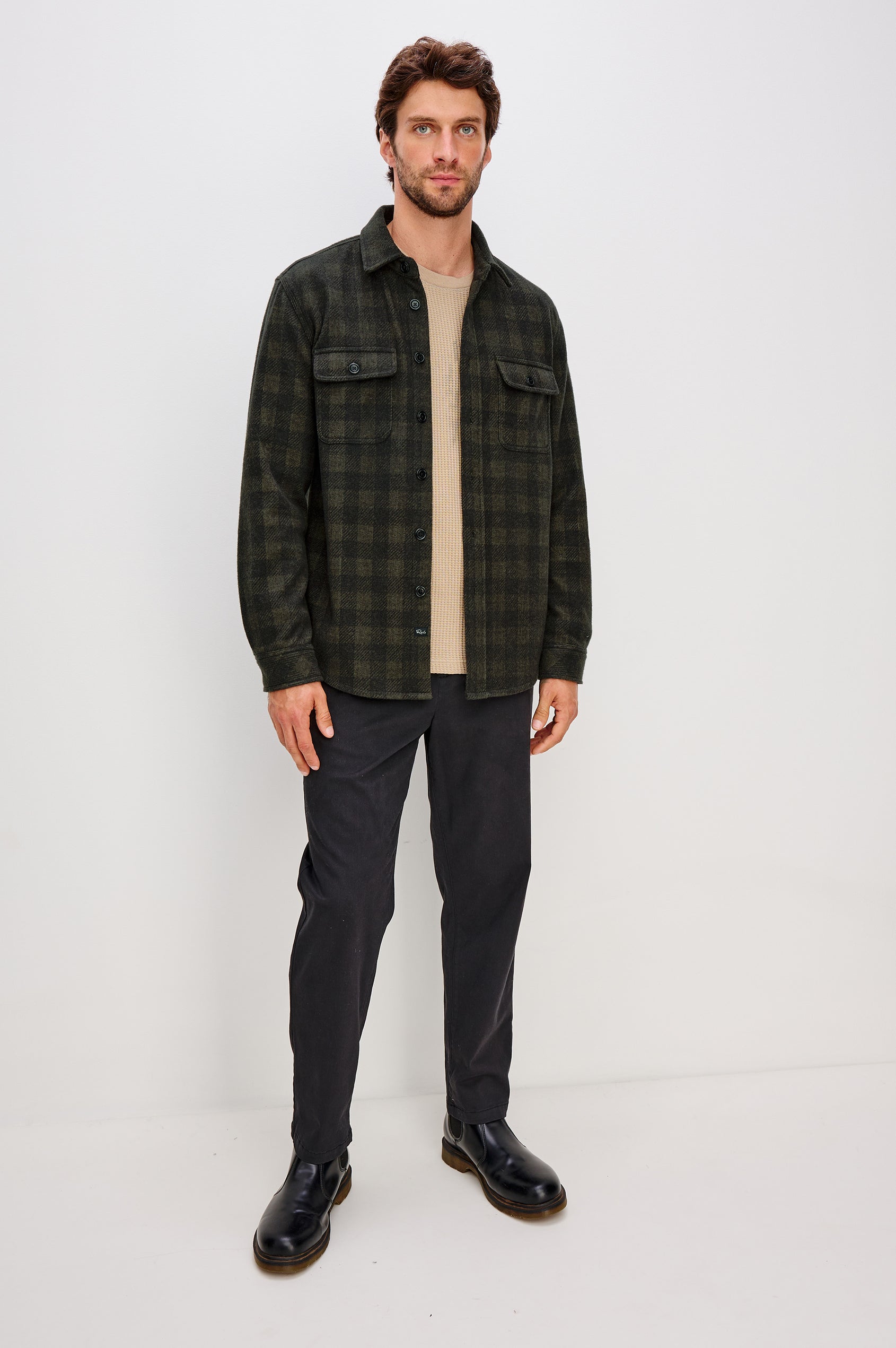 Alder Button Front Plaid Shirt in Brushed Stretch Cotton Blend With Collar, Buttoned Flap Chest Pockets, and Long Sleeves in Onyx Surplus Green Black Colorway - Full Body Front View Featured on Model
