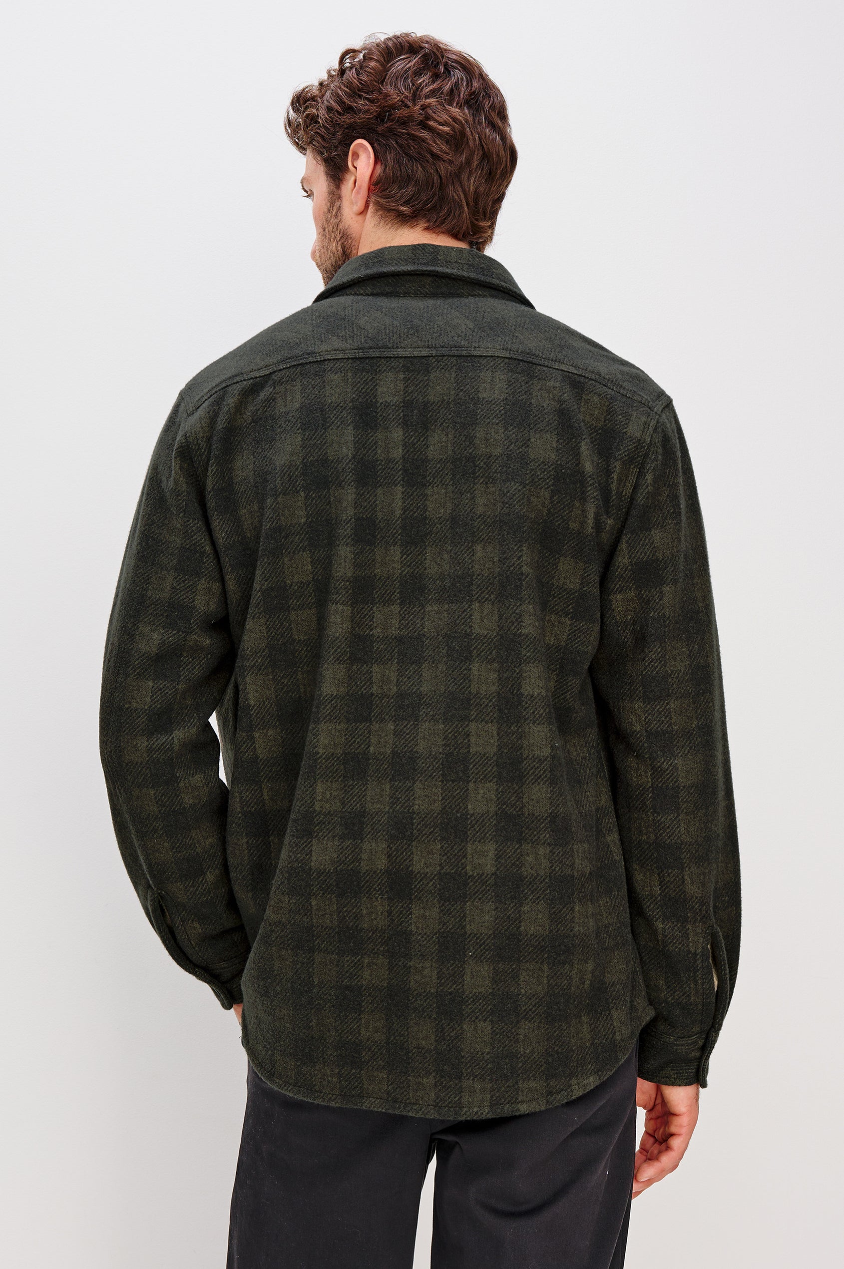 Alder Button Front Plaid Shirt in Brushed Stretch Cotton Blend With Collar, Buttoned Flap Chest Pockets, and Long Sleeves in Onyx Surplus Green Black Colorway - Upper Body Back View Featured on Model