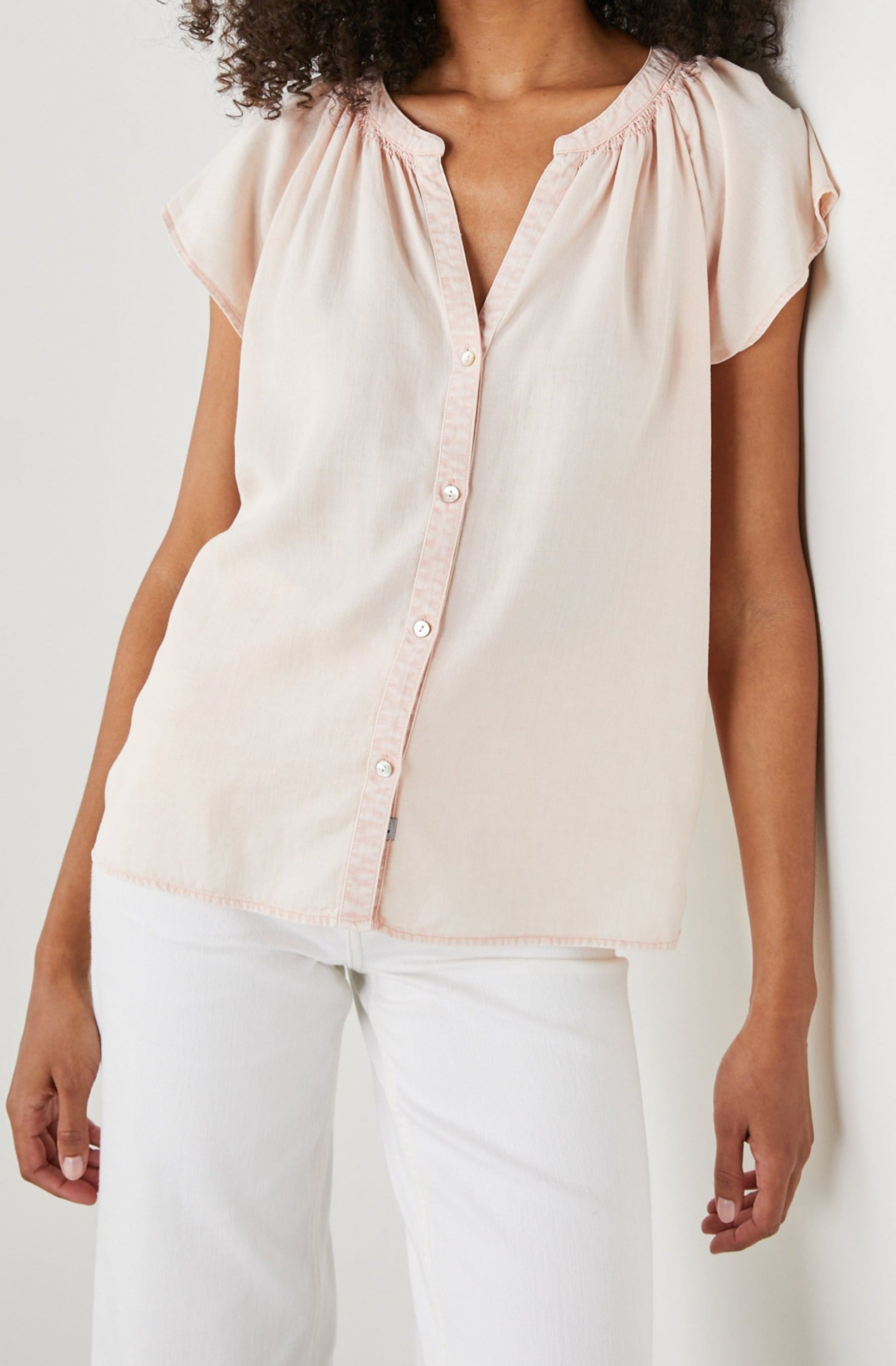 Alena Short Sleeve Top with Flutter Sleeves, a V Neck, Buttons Down the Bodice and Ruching along the Collar in Petal Colorway - Front View Featured on Model