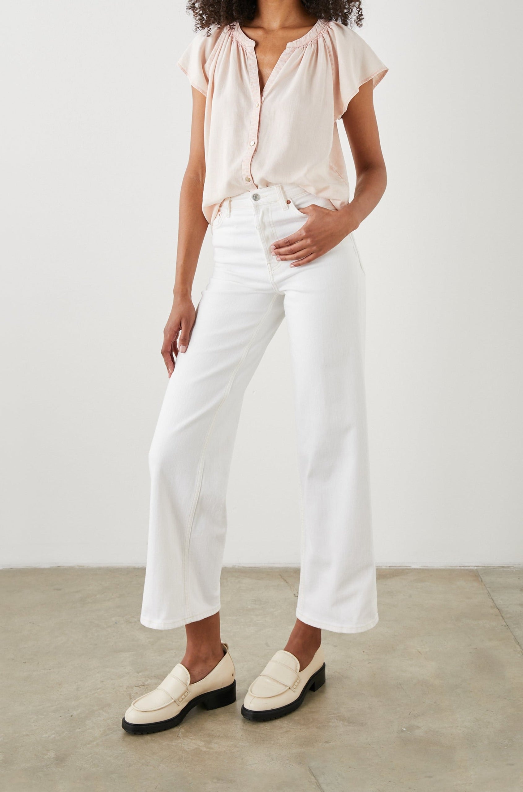 Alena Short Sleeve Top with Flutter Sleeves, a V Neck, Buttons Down the Bodice and Ruching along the Collar in Petal Colorway - Front Full Body View Featured on Model