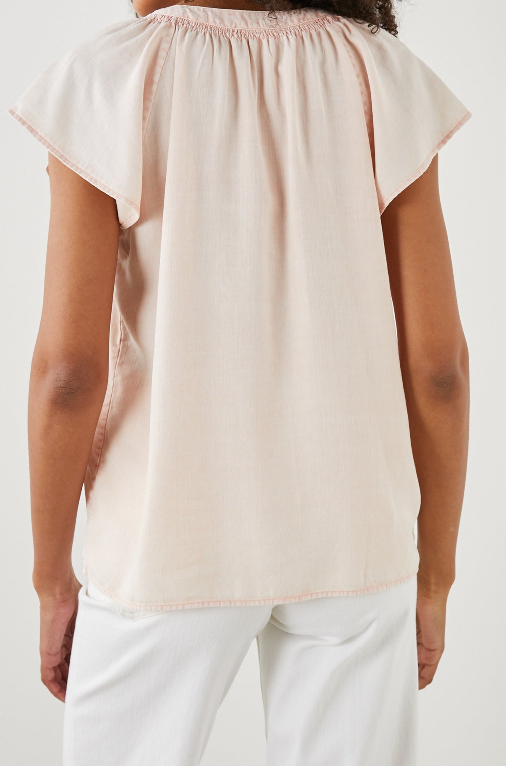 Alena Short Sleeve Top with Flutter Sleeves, a V Neck, Buttons Down the Bodice and Ruching along the Collar in Petal Colorway - Back View Featured on Model