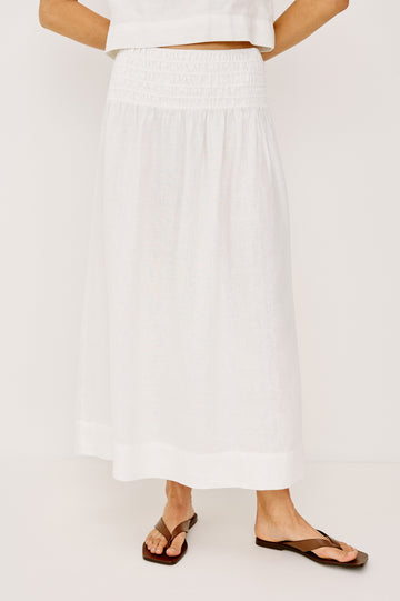 Alessa Midi Skirt in Heavy Linen With Wide Smocked Waistband and A-Line Silhouette in White Colorway - Lower Body Front View Featured on Model