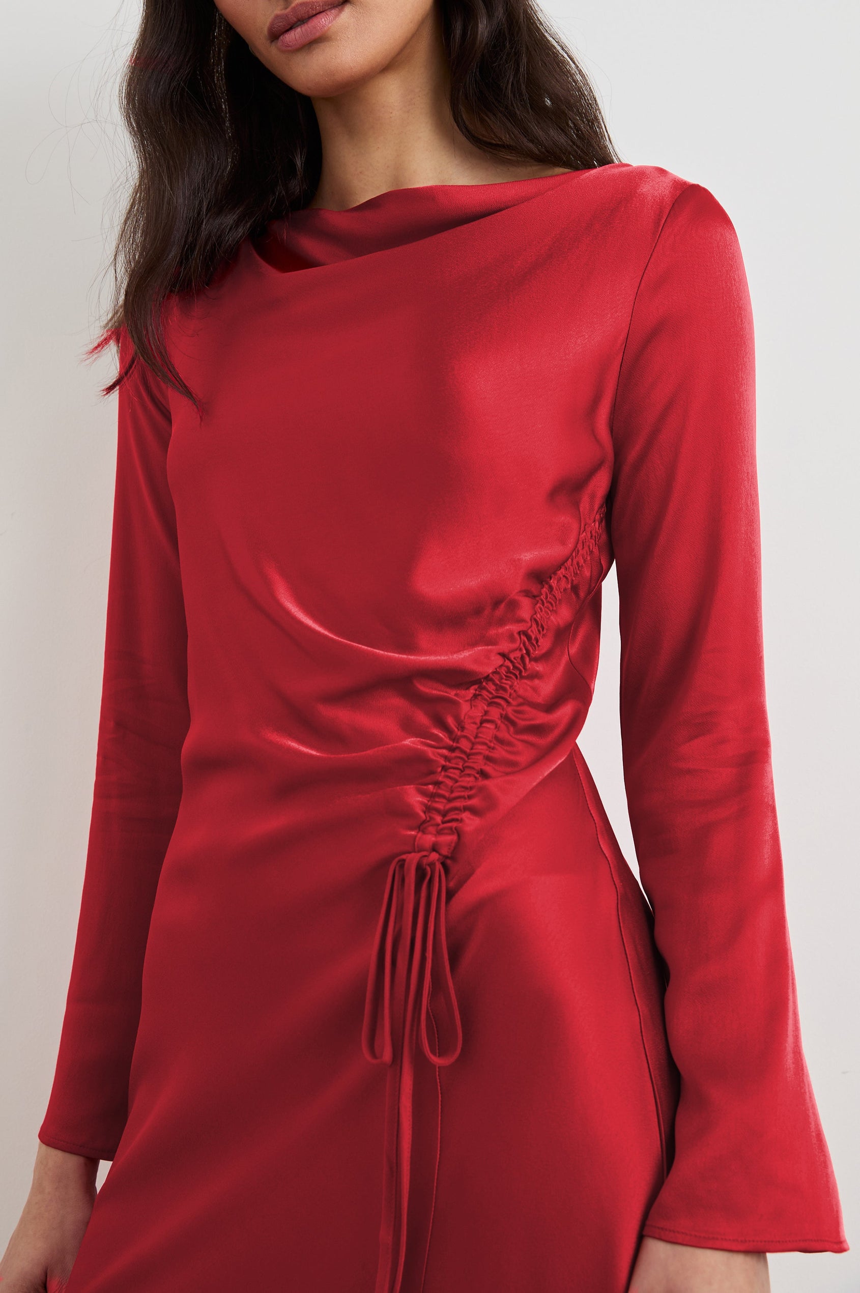 Alessandra Long Sleeve Mini Dress with a Slight Cowl at the Neck and Ruching with a Drawstring on the Left Side in Scarlet Colorway - Front View Featured on Model