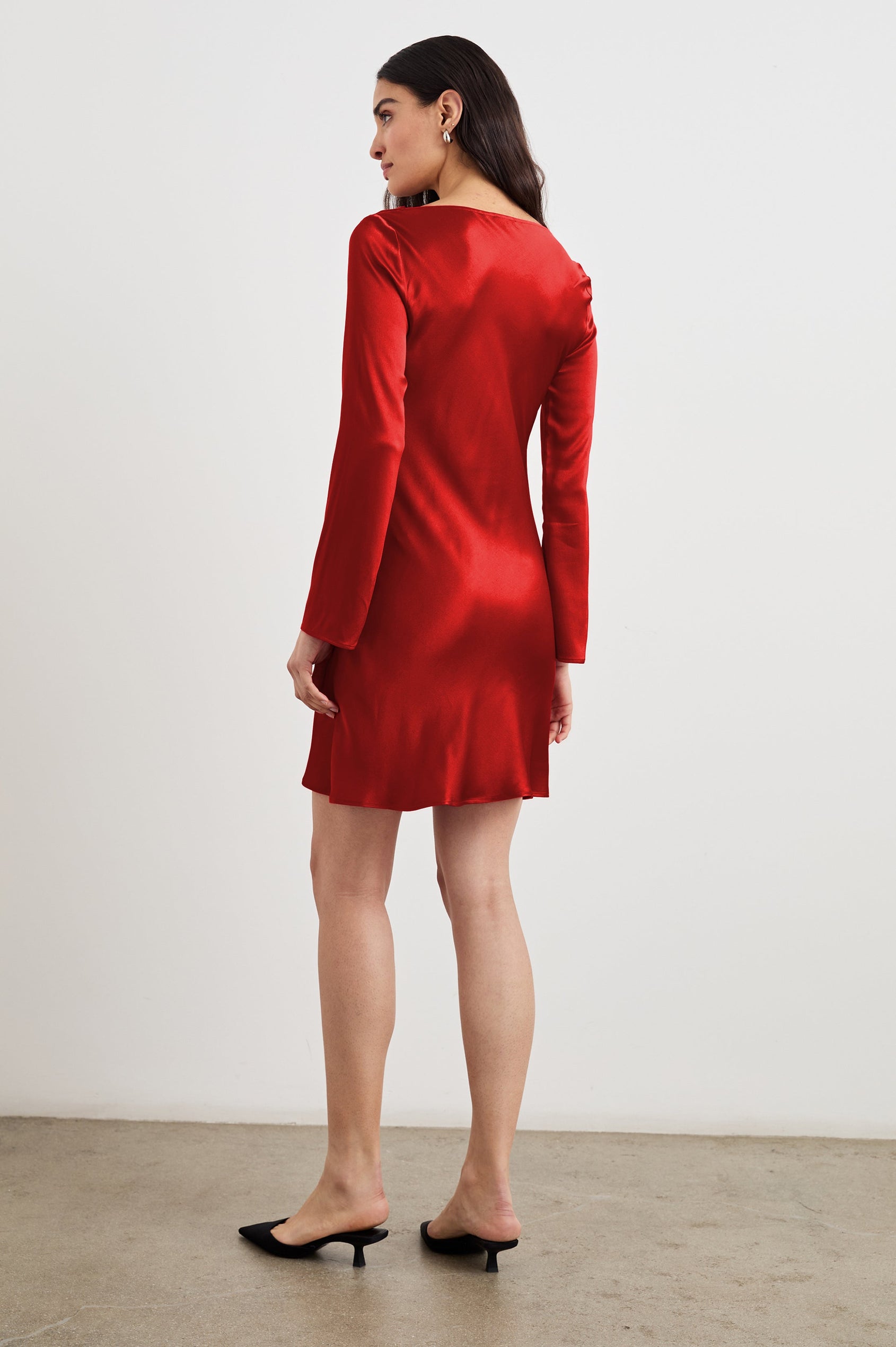 Alessandra Long Sleeve Mini Dress with a Slight Cowl at the Neck and Ruching with a Drawstring on the Left Side in Scarlet Colorway - Back Full Body View Featured on Model