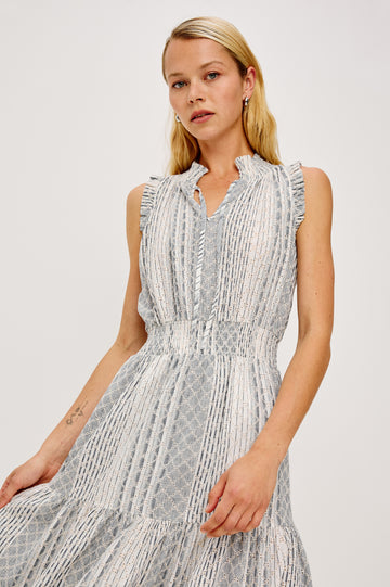 Alessi Maxi Dress in Linen With Smocked Split V-Neckline With Center-Front Ties Diamond Eyelet Detailing All Over Ruffled Trim and Fully Lined Tiered Skirt in Striped Eyelet Colorway - Upper Body Front View Featured on Model