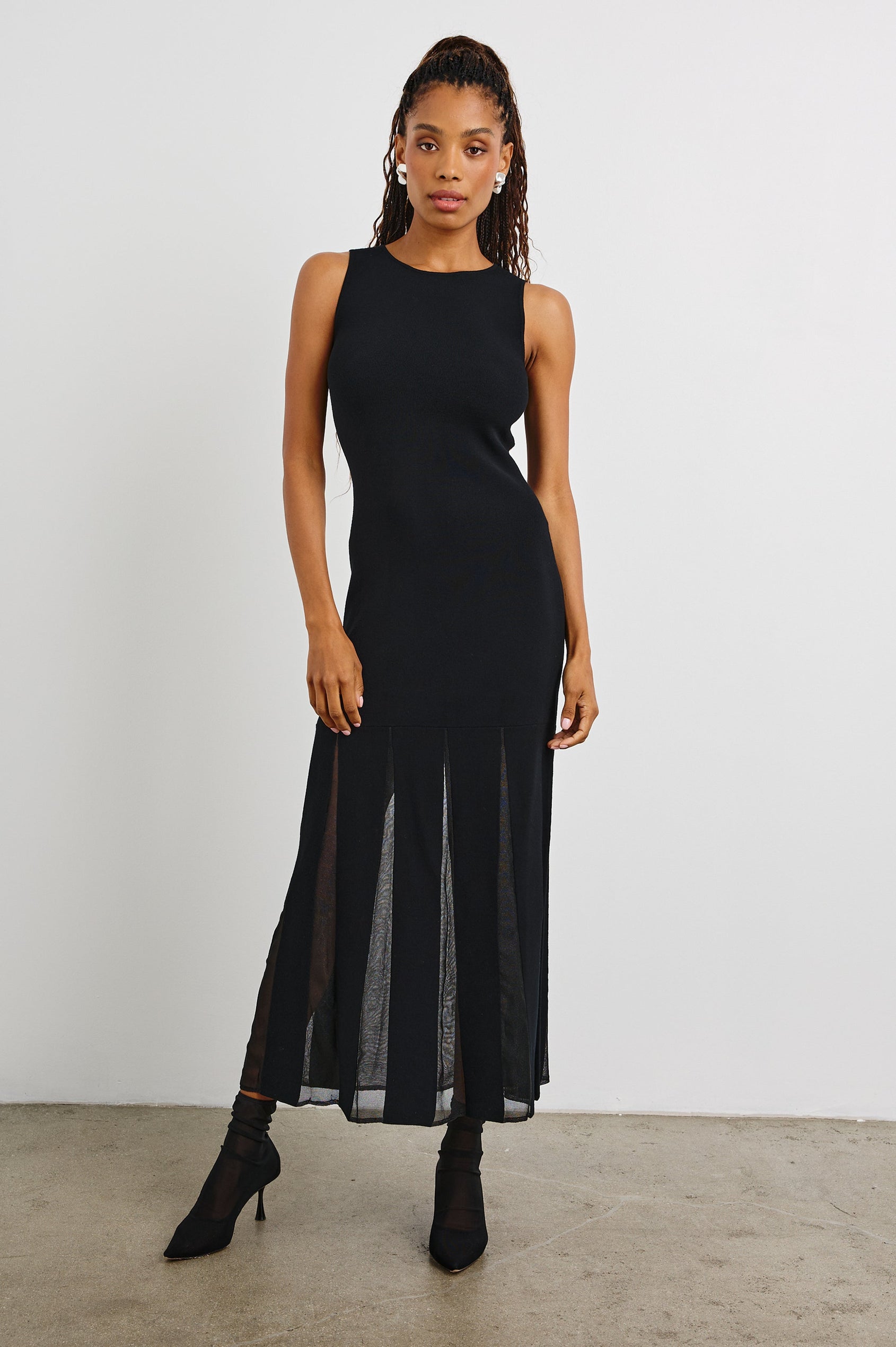 Alessia Sleeveless Maxi Dress with a Crew Neck and Sheer Vertical Inserts along the Hem from the Mid-Thigh in Black Colorway - Front Full Body View Featured on Model 