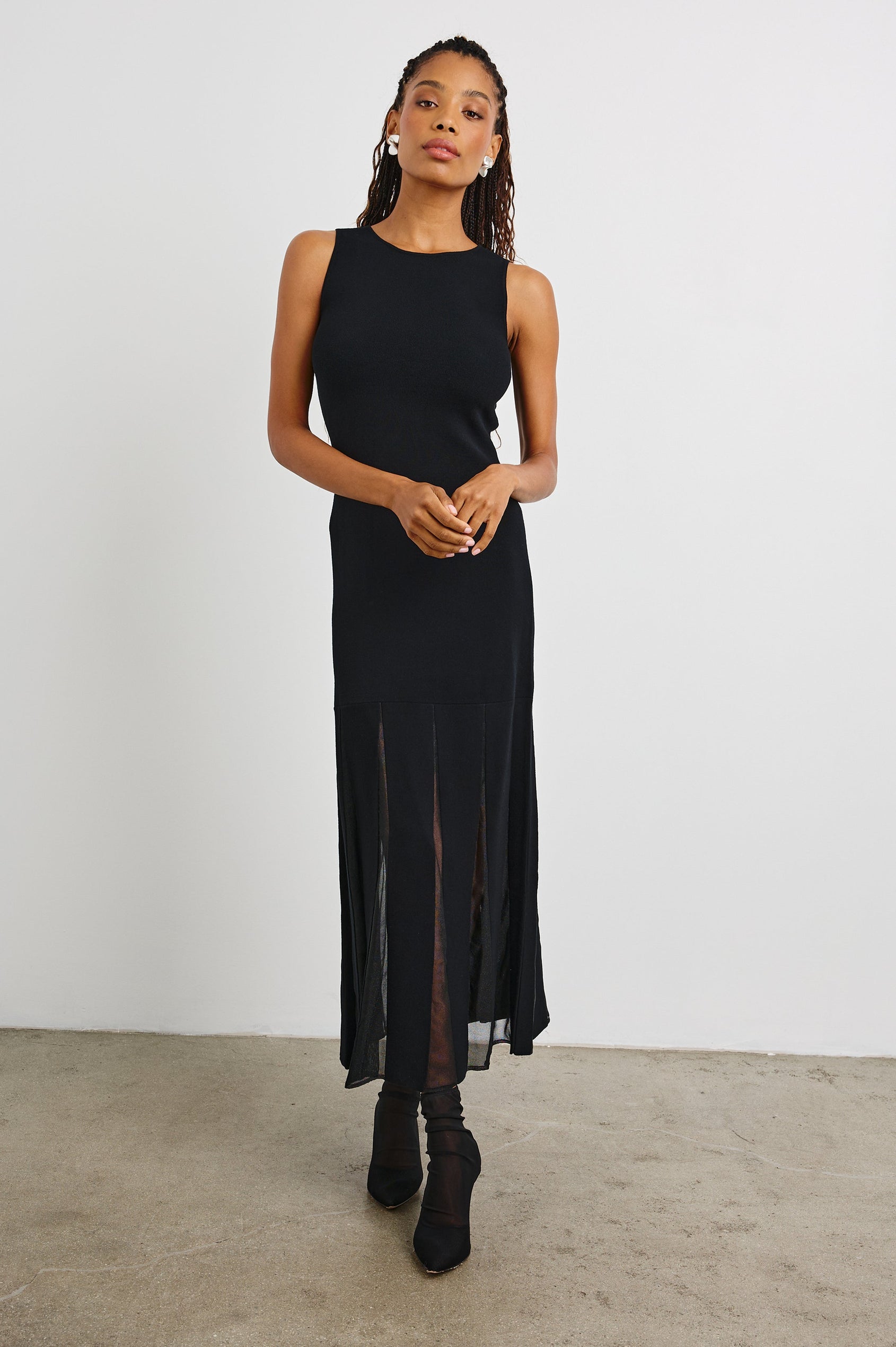 Alessia Sleeveless Maxi Dress with a Crew Neck and Sheer Vertical Inserts along the Hem from the Mid-Thigh in Black Colorway - Front Full Body View Featured on Model 