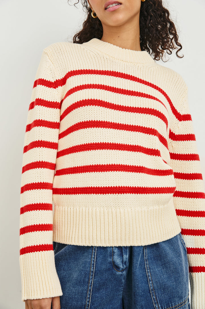 Alise crewneck wool sweater with ribbed detailing on cuffs and collar in Cherry Stripe - close up of details on model