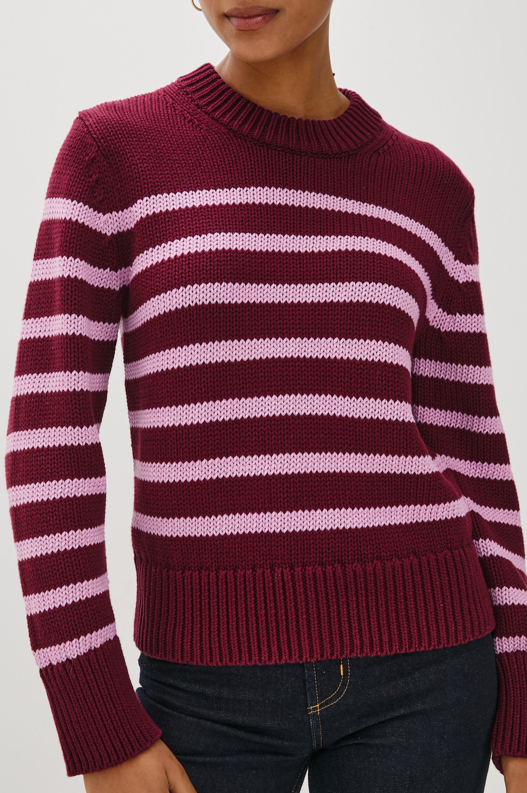 Alise crewneck wool sweater with ribbed detailing on cuffs and collar in Mulberry Stripe - Close Up front view on model