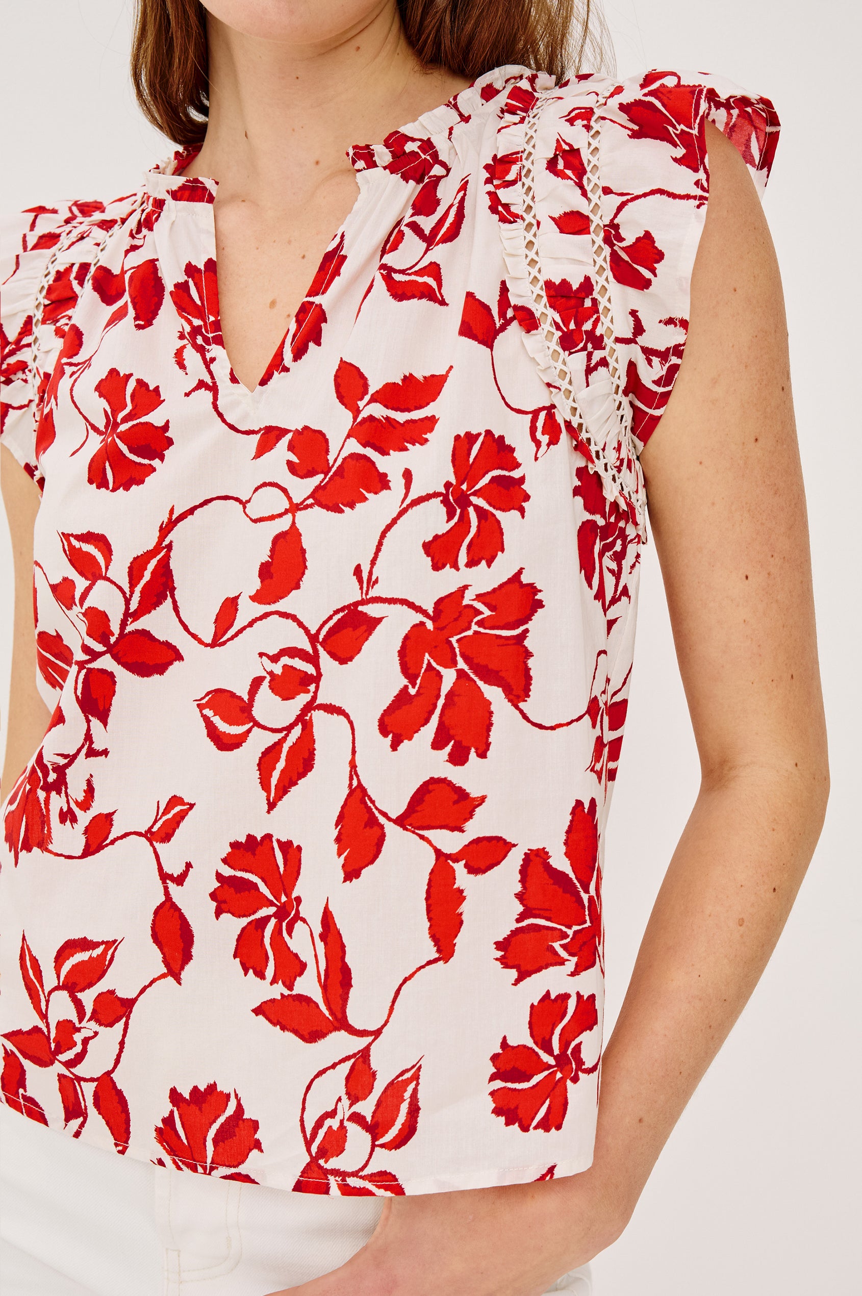Allea Top in Poplin With Relaxed Fit Split V-Neck. Flutter Sleeves With Contrast Stitcing and Lattice Cutwork in Red Jasmine Colorway - Upper Body Close Up View Featured on Model