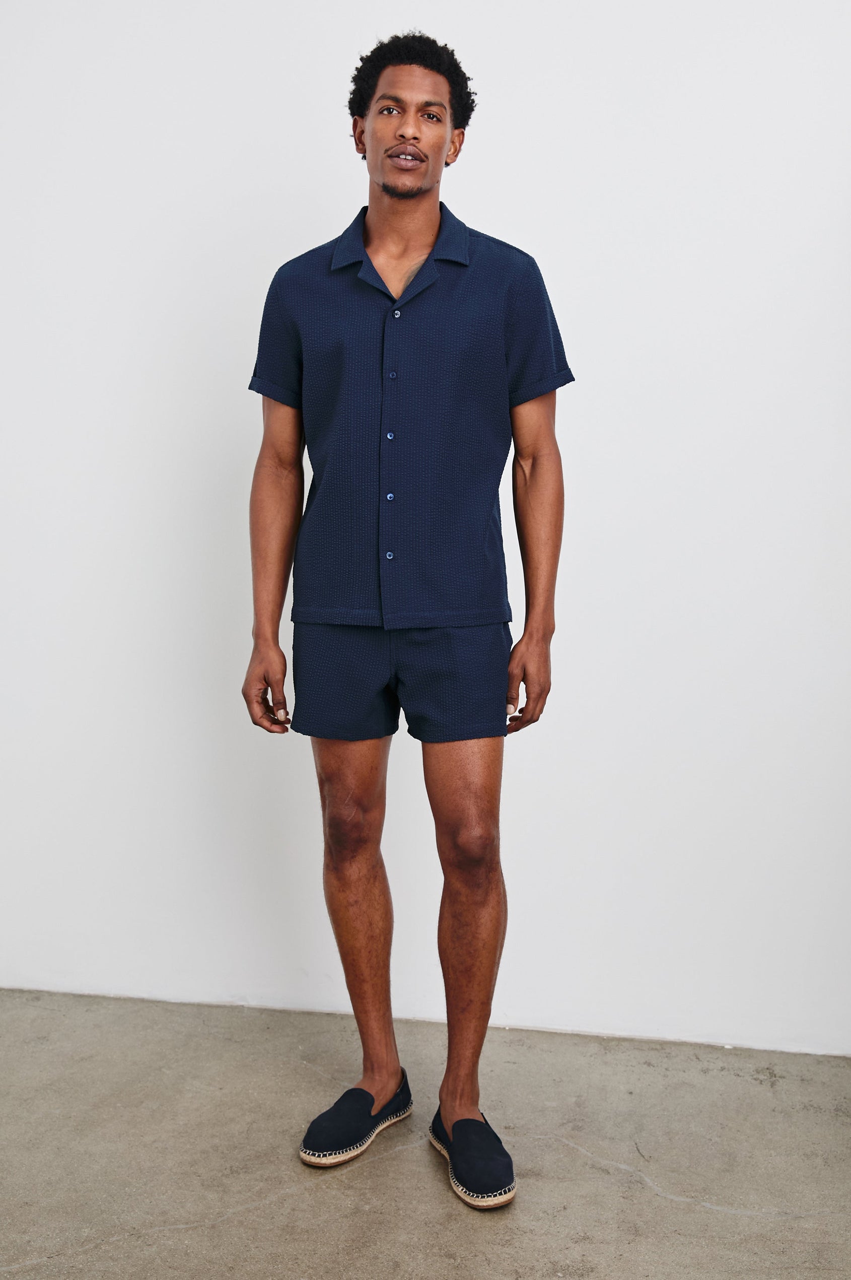Amalfi Short-Sleeve Button Up in Navy Seersucker Colorway - Front Full Body View Featured on Model