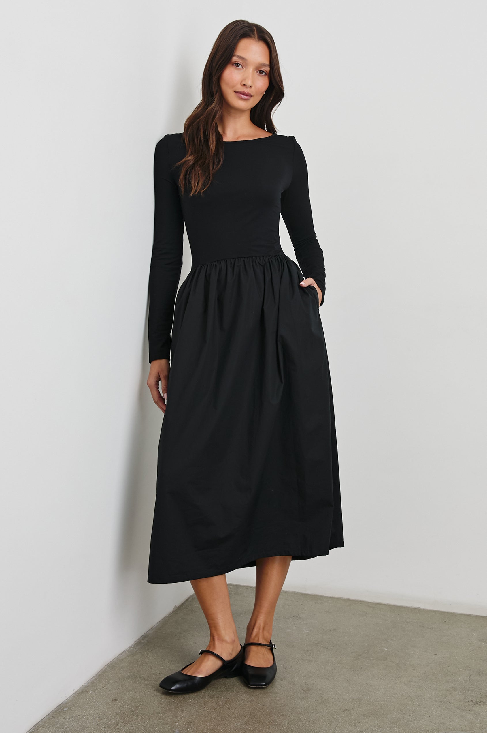 Amberly Long-Sleeve Midi Dress with Boat Neckline in Black Colorway - Front Full Body View Featured on Model