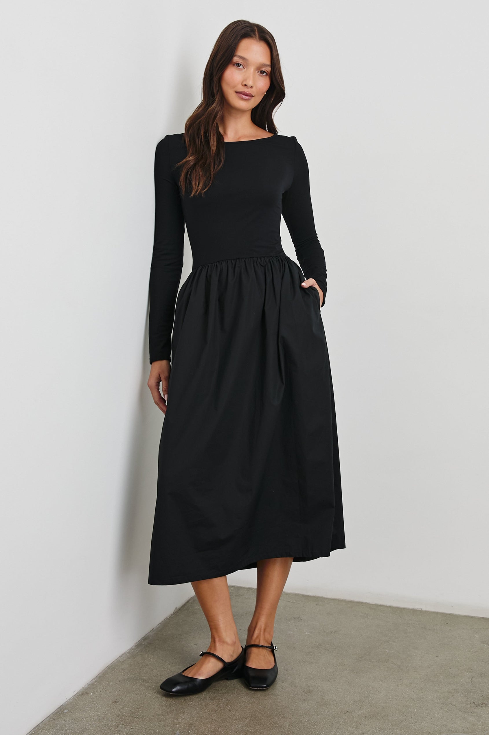 Amberly Long-Sleeve Midi Dress with Boat Neckline in Black Colorway - Front Full Body View Featured on Model