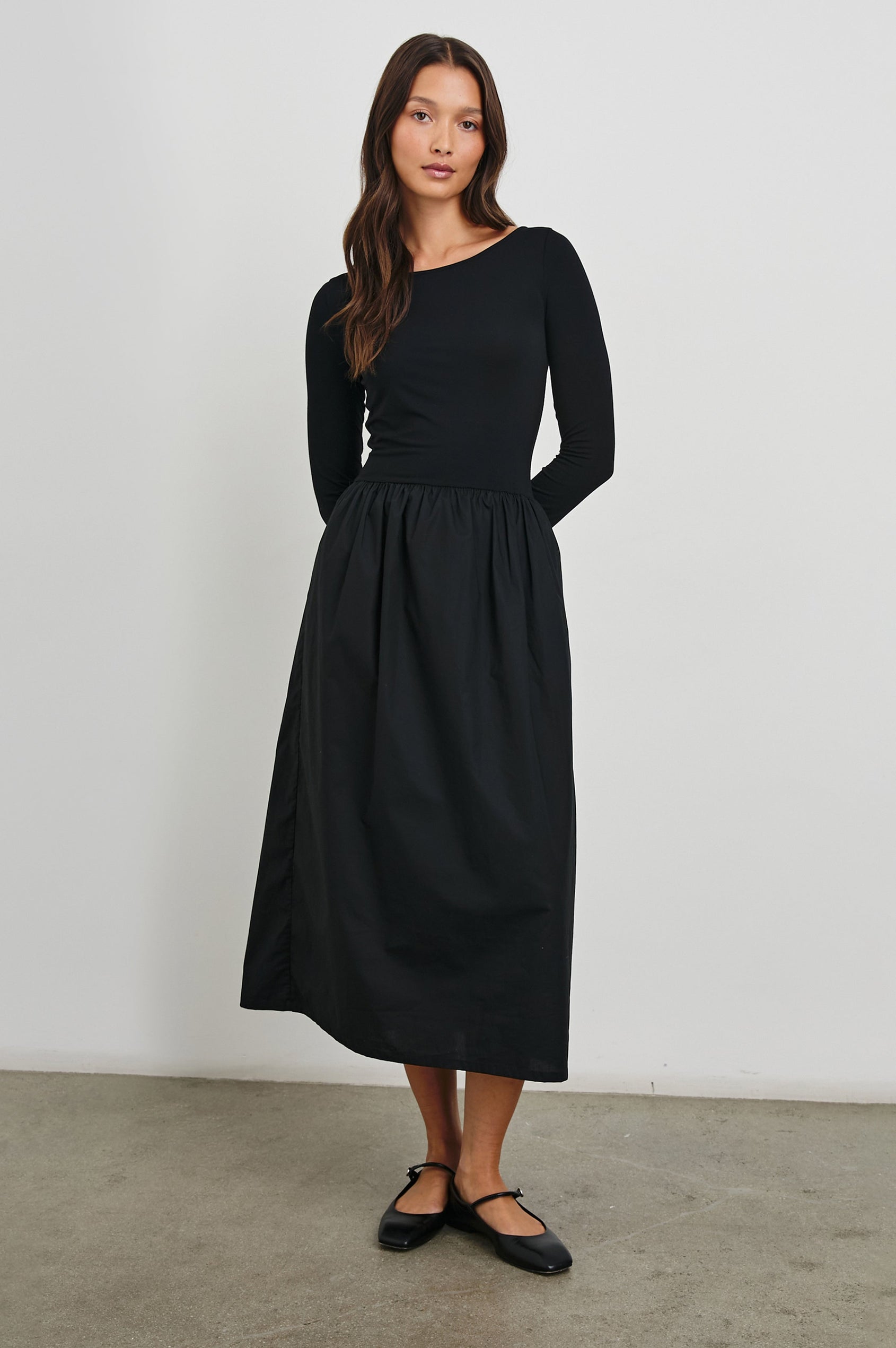 Amberly Long-Sleeve Midi Dress with Boat Neckline in Black Colorway - Front Full Body View Featured on Model