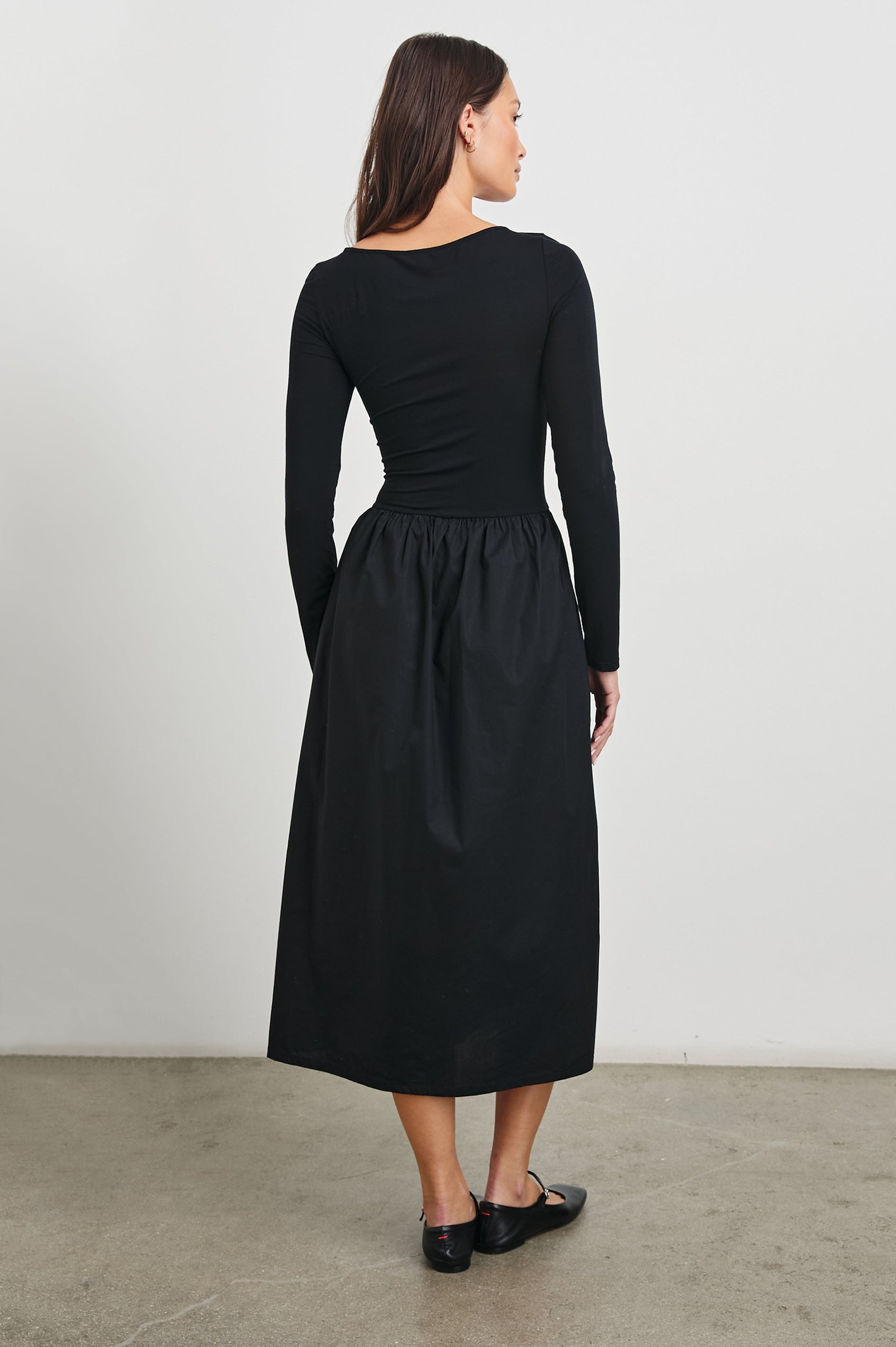 Amberly Long-Sleeve Midi Dress with Boat Neckline in Black Colorway - Back Full Body View Featured on Model