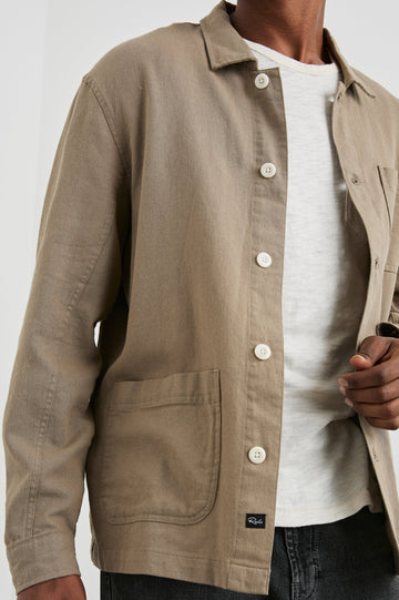 Ambrose Jacket with Button Closure, Two Front Patch Pockets and a Chest Patch Pocket in Barley Colorway - Front View Featured on Model