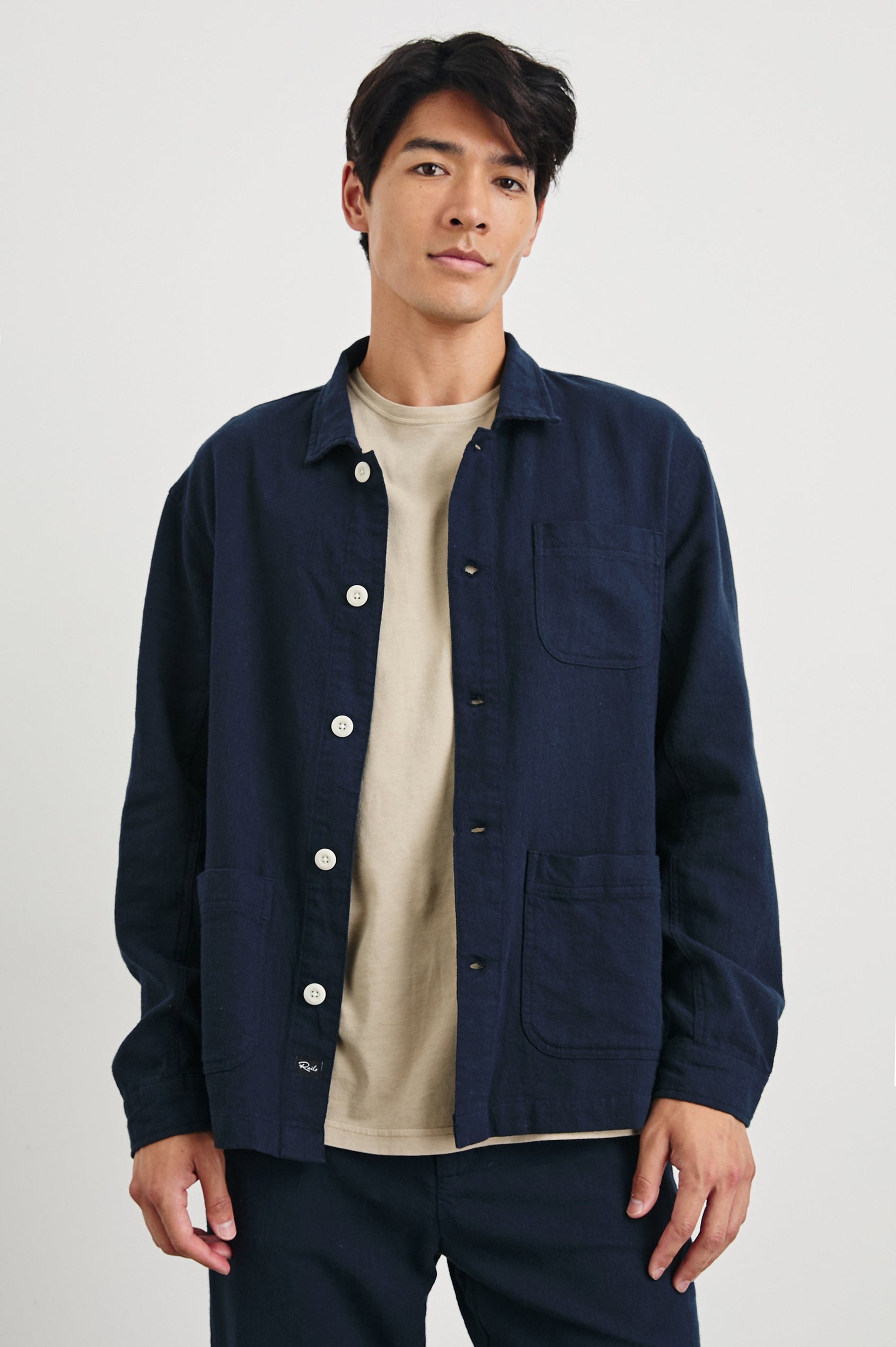 Ambrose Jacket with Button Closure and Two Front Patch Pockets and a Chest Patch Pocket in Deep Meridian Colorway - Front View Featured on Model