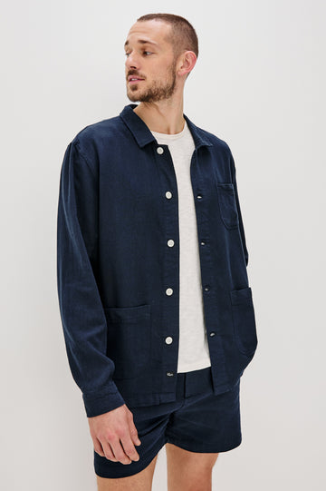 Ambrose Jacket with Button Closure and Two Front Patch Pockets and a Chest Patch Pocket in Deep Meridian Colorway - Front View Featured on Model
