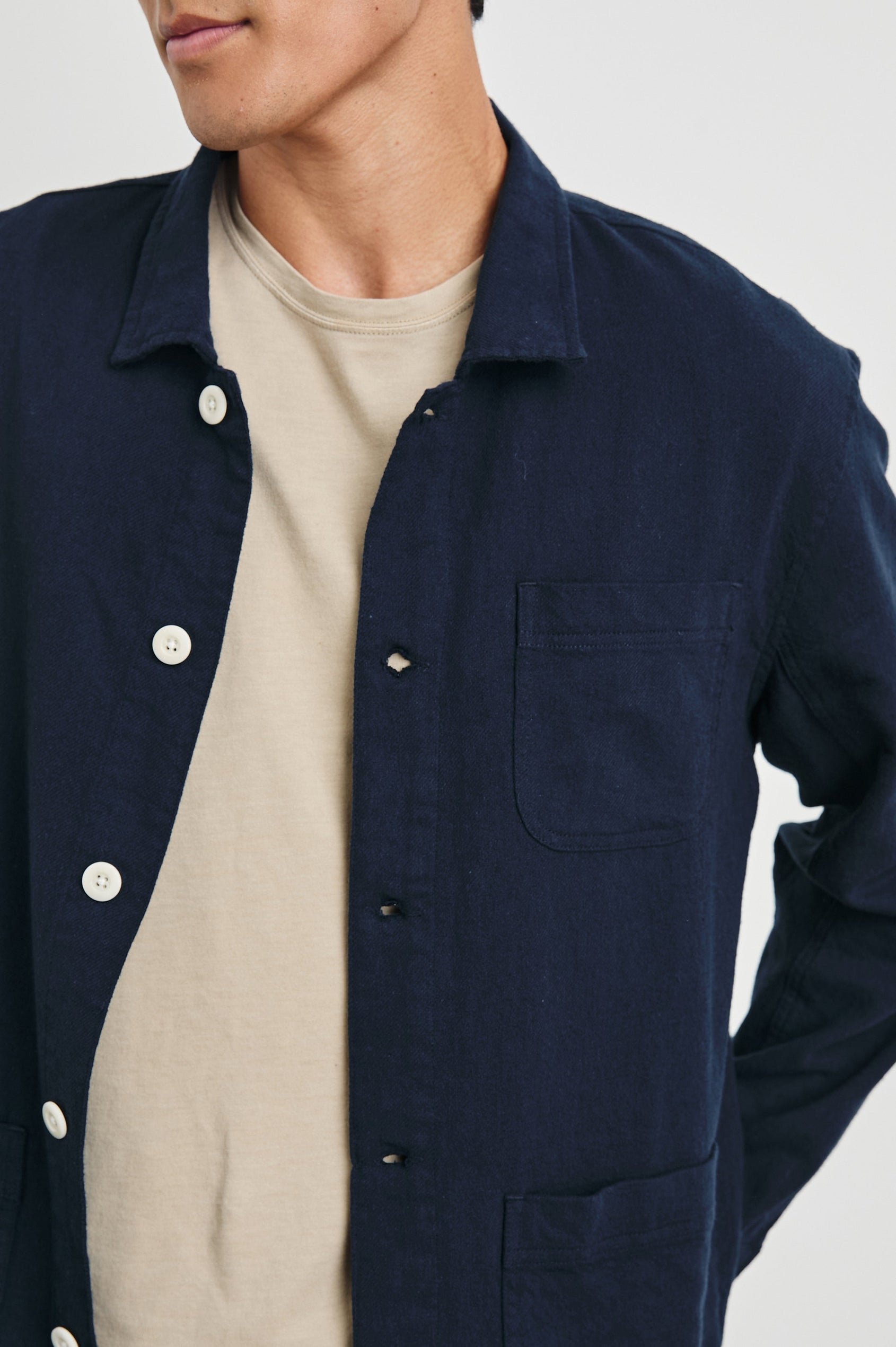 Ambrose Jacket with Button Closure and Two Front Patch Pockets and a Chest Patch Pocket in Deep Meridian Colorway - Front View Featured on Model