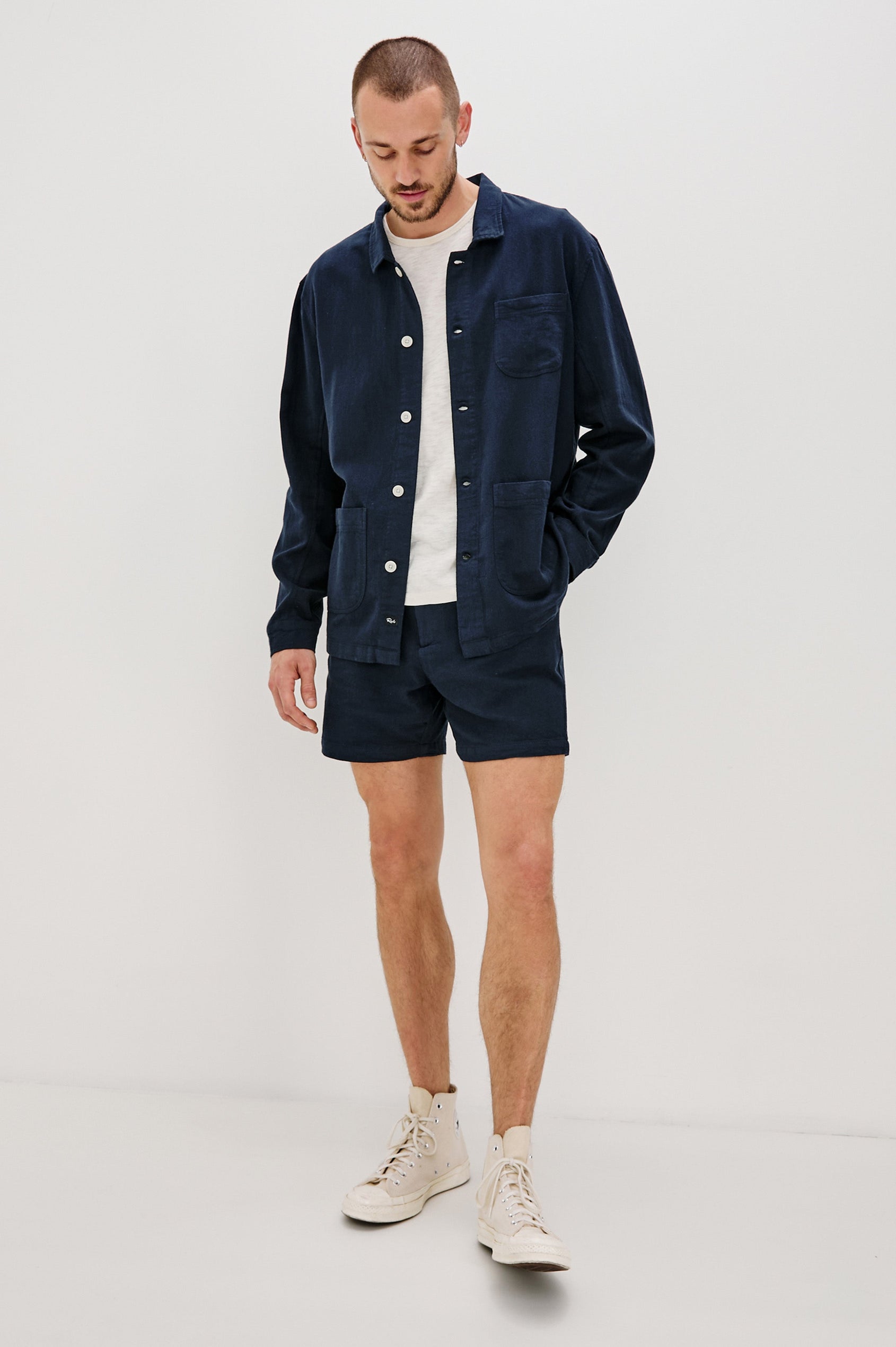 Ambrose Jacket with Button Closure and Two Front Patch Pockets and a Chest Patch Pocket in Deep Meridian Colorway - Front Full Body View Featured on Model