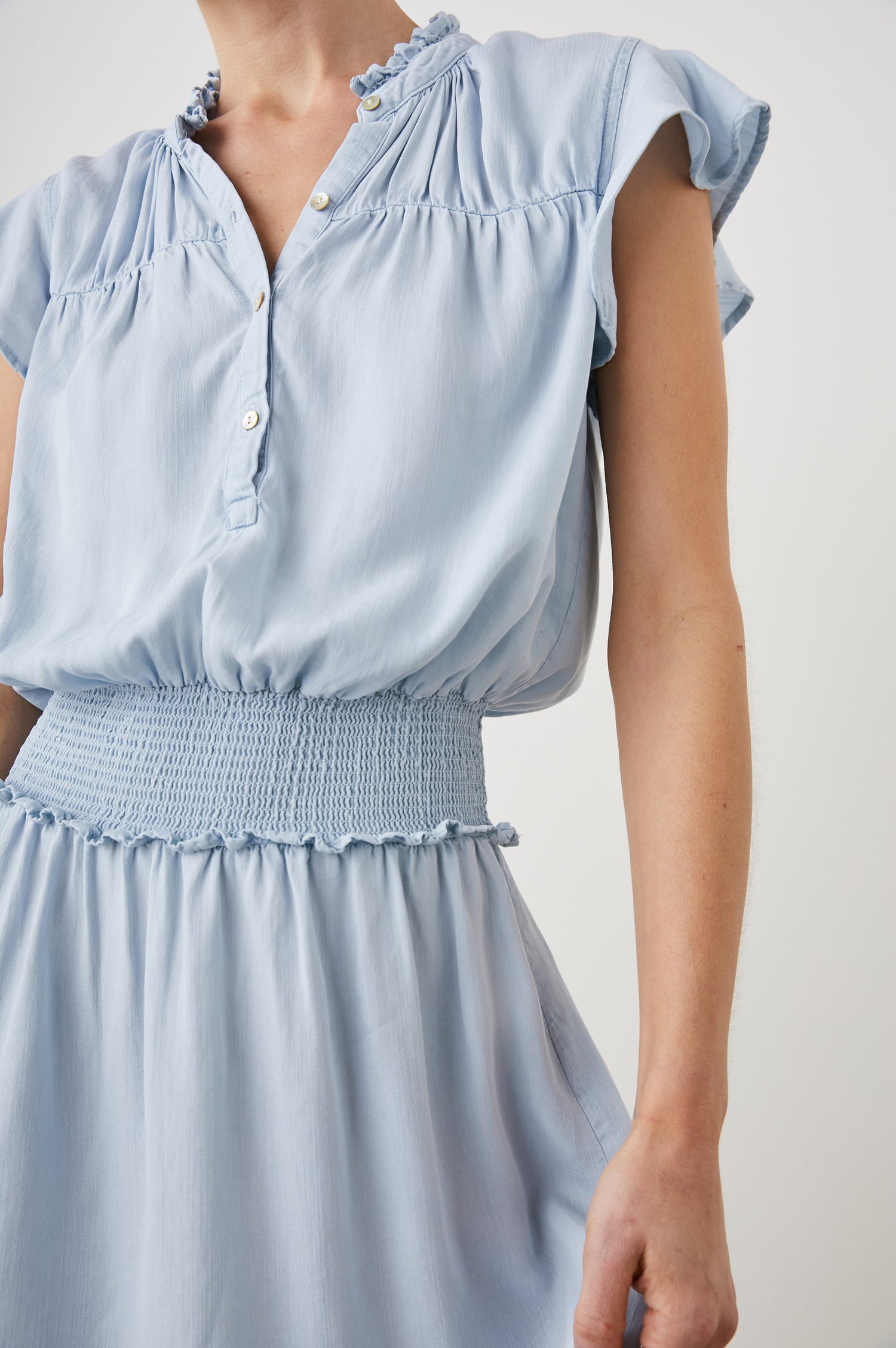 Amina Short Sleeve Mini Dress with Flutter Sleeves, a Ruffled Collar with Ruching, a Button Placket, and a Shirred Waist in Light Vintage Colorway - Front View Featured on Model 