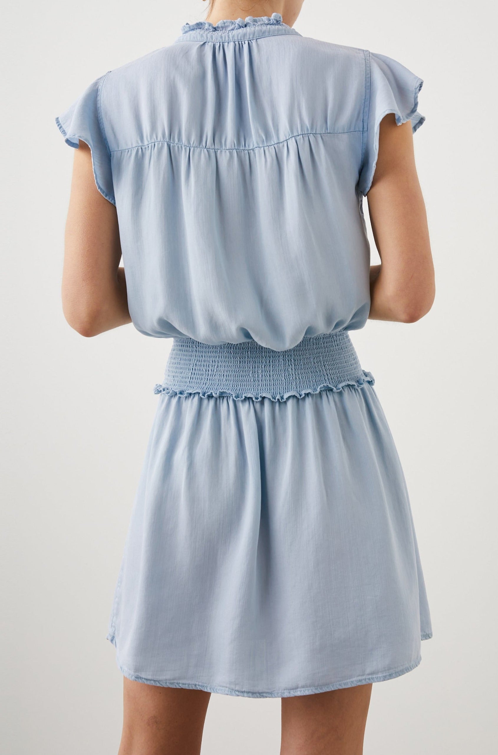 Amina Short Sleeve Mini Dress with Flutter Sleeves, a Ruffled Collar with Ruching, a Button Placket, and a Shirred Waist in Light Vintage Colorway - Back View Featured on Model 